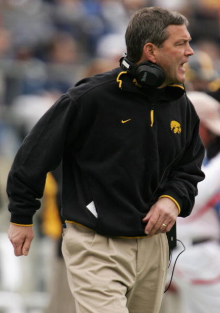 STATE COLLEGE, PA - OCTOBER 23:  Head coach Kirk Ferentz of the Iowa Hawkeyes leads his team against the Penn State Nittnay Lions as the Iowa Hawkeyes defeated Penn State Nittnay Lions 6-4 during NCAA football at Beaver Stadium on October 23, 2004 in Stat