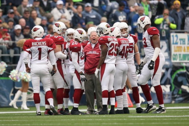 SEATTLE - NOVEMBER 16:  Special teams coach Kevin Spencer of the Arizona Cardinals huddle with his team on the field during the game against the Seattle Seahawks on November 16, 2008 at Qwest Field in Seattle, Washington. (Photo by Otto Greule Jr/Getty Im
