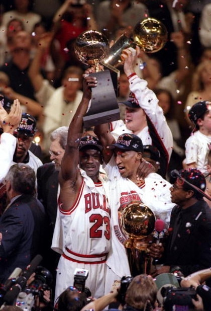 13 Jun 1997:  Michael Jordan #23 and Scottie Pippen #33 of the Chicago Bulls celebrate with the trophy after winning game 6 of the 1997 NBA Finals at the United Center in Chicago, Illinois. The Bulls defeated the Jazz 90-86 to win the series and claim the