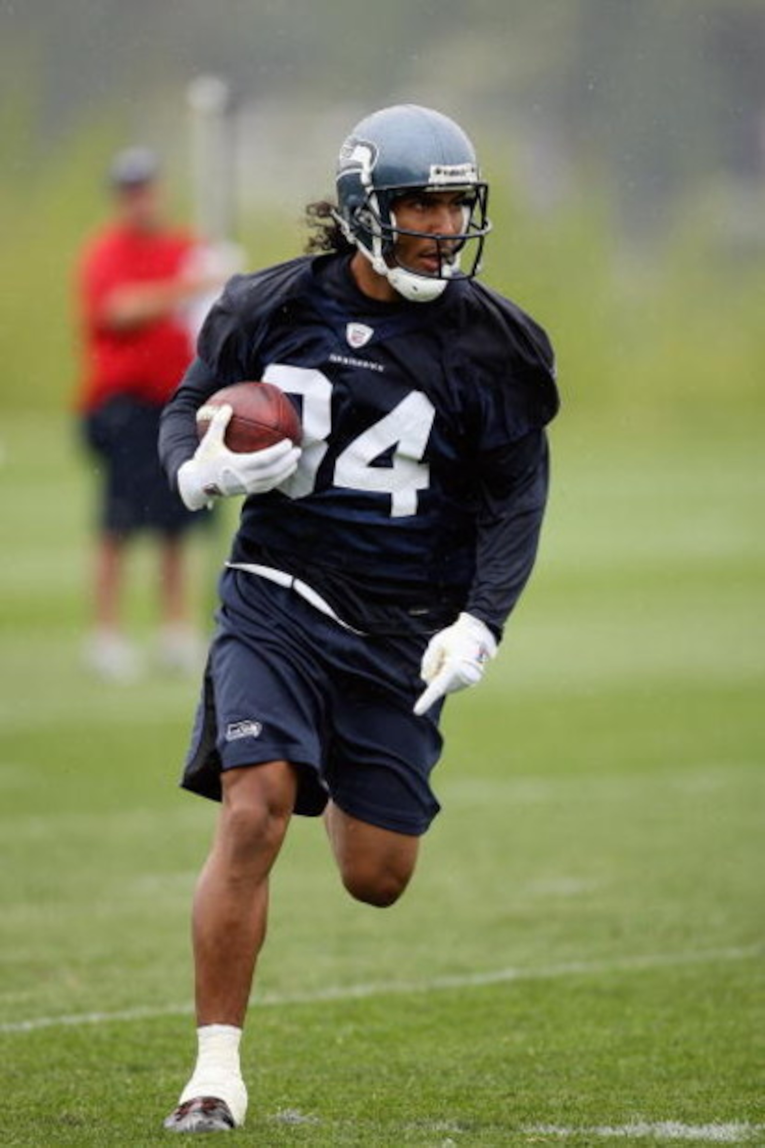 RENTON, WA - MAY 2:  T.J. Houshmandzadeh #84 of the Seattle Seahawks runs with the ball during minicamp at the Seahawks training facility on May 2, 2009 in Renton, Washington. (Photo by Otto Greule Jr/Getty Images) 