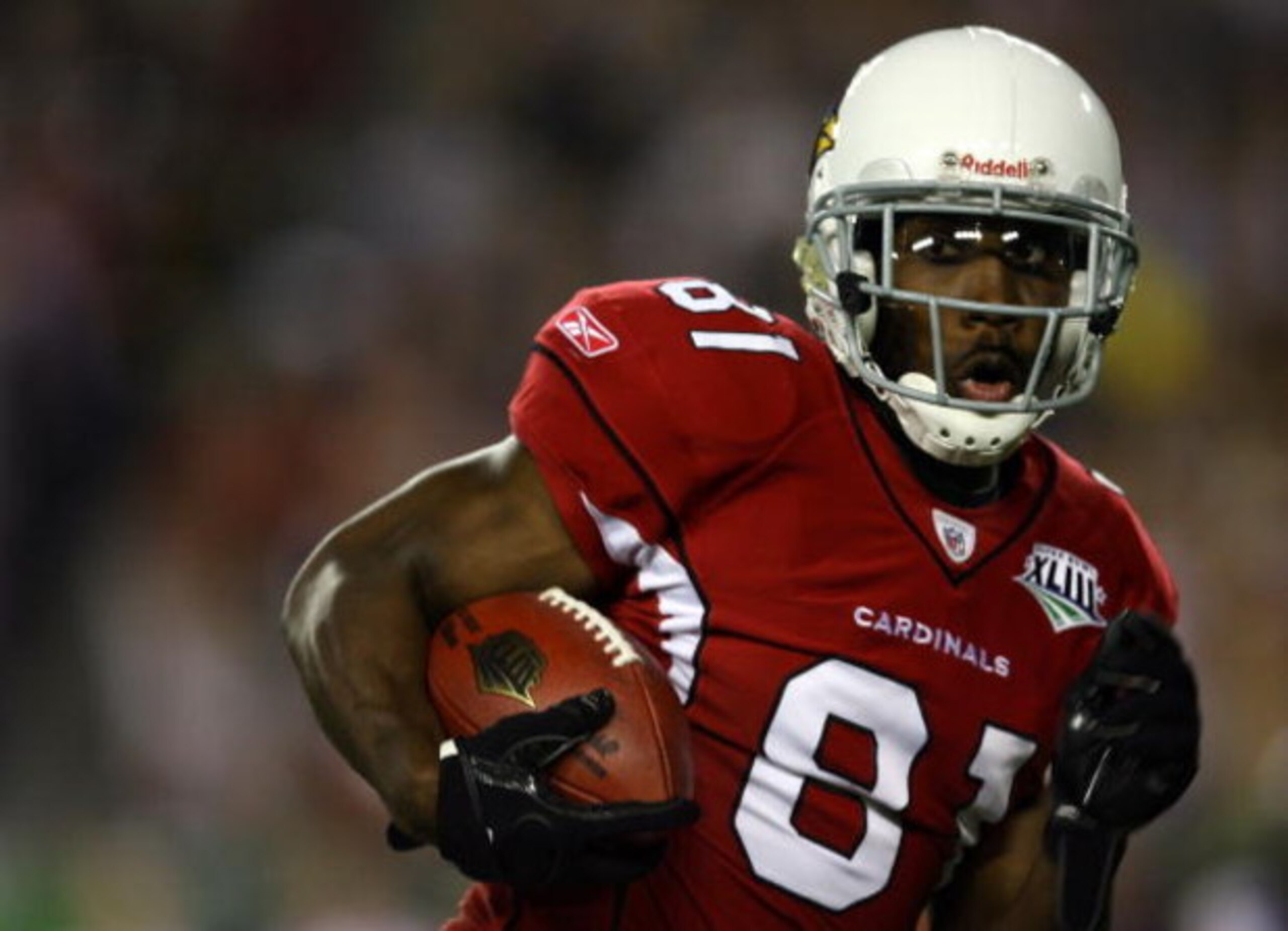 TAMPA, FL - FEBRUARY 01:  Wide receiver Anquan Boldin #81 of the Arizona Cardinals runs for yards after the catch on a 45-yard reception in the second quarter against the Pittsburgh Steelers during Super Bowl XLIII on February 1, 2009 at Raymond James Sta