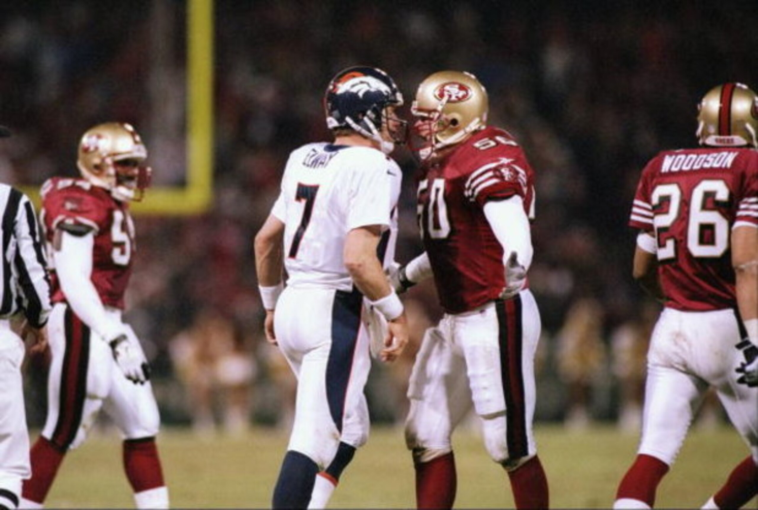 15 Dec 1997:  Quarterback John Elway #7 of the Denver Broncos argues with linebacker Gary Plummer #50 of the San Francisco 49ers during the Broncos 34-17 loss at 3Com Park in San Francisco, California. Mandatory Credit: Otto Greule  /Allsport