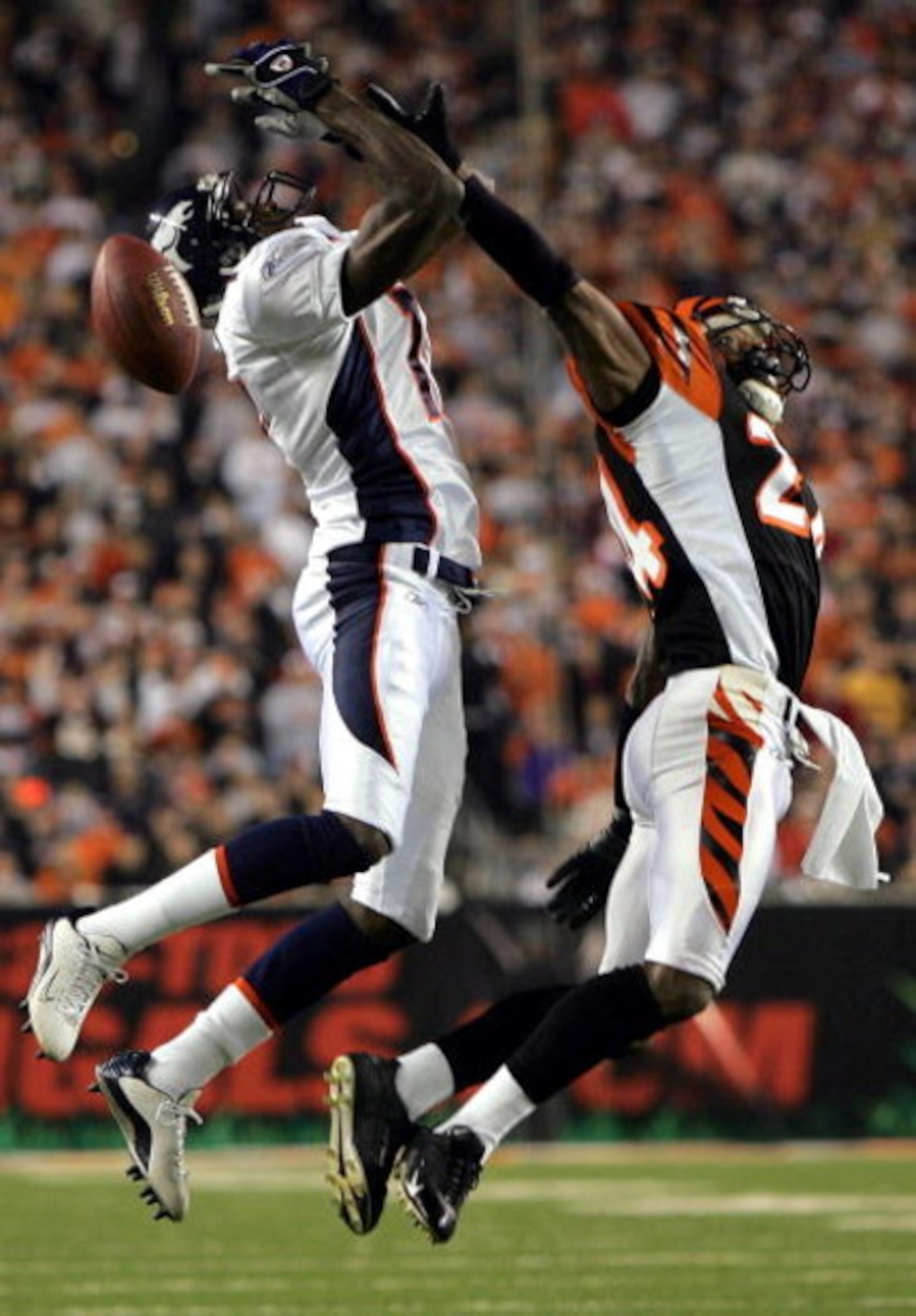 CINCINNATI - OCTOBER 25:  Wide receiver Darius Watts #17 of the Denver Broncos jumps for a pass while defended by Deltha O'Neal #24 of the Cincinnati Bengals on October 25, 2004 at Paul Brown Stadium in Cincinnati, Ohio. The Bengals defeated the Broncos 2