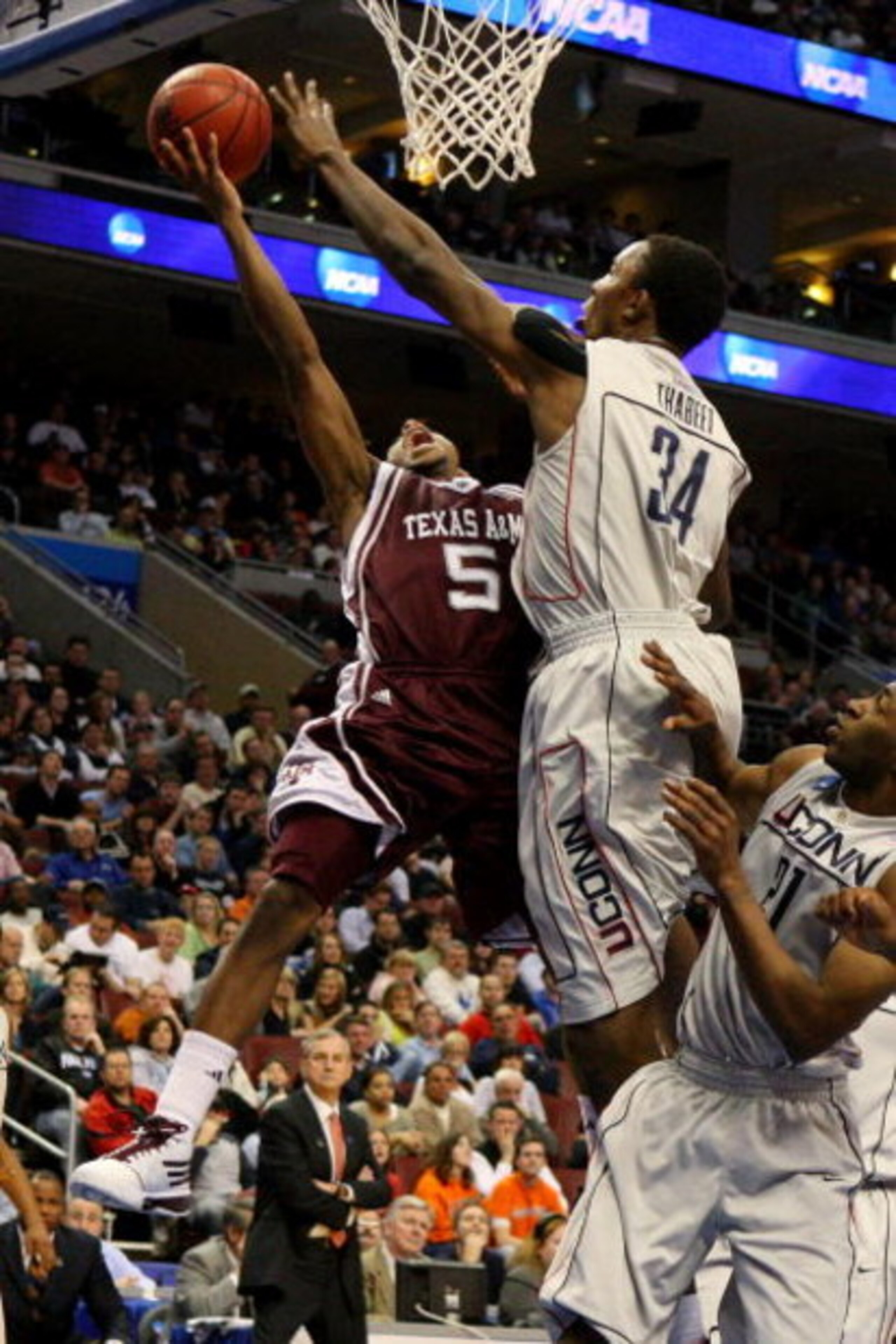 PHILADELPHIA - MARCH 21: Dash Harris #5 of the Texas A&M Aggies shoots against Hasheem Thabeet #34 of the Connecticut Huskies during the second round of the NCAA Division I Men's Basketball Tournament at the Wachovia Center on March 21, 2009 in Philadelp PHILADELPHIA - MARCH 21: Dash Harris #5 of the Texas A&M Aggies shoots against Hasheem Thabeet #34 of the Connecticut Huskies during the second round of the NCAA Division I Men's Basketball Tournament at the Wachovia Center on March 21, 2009 in Philadelp