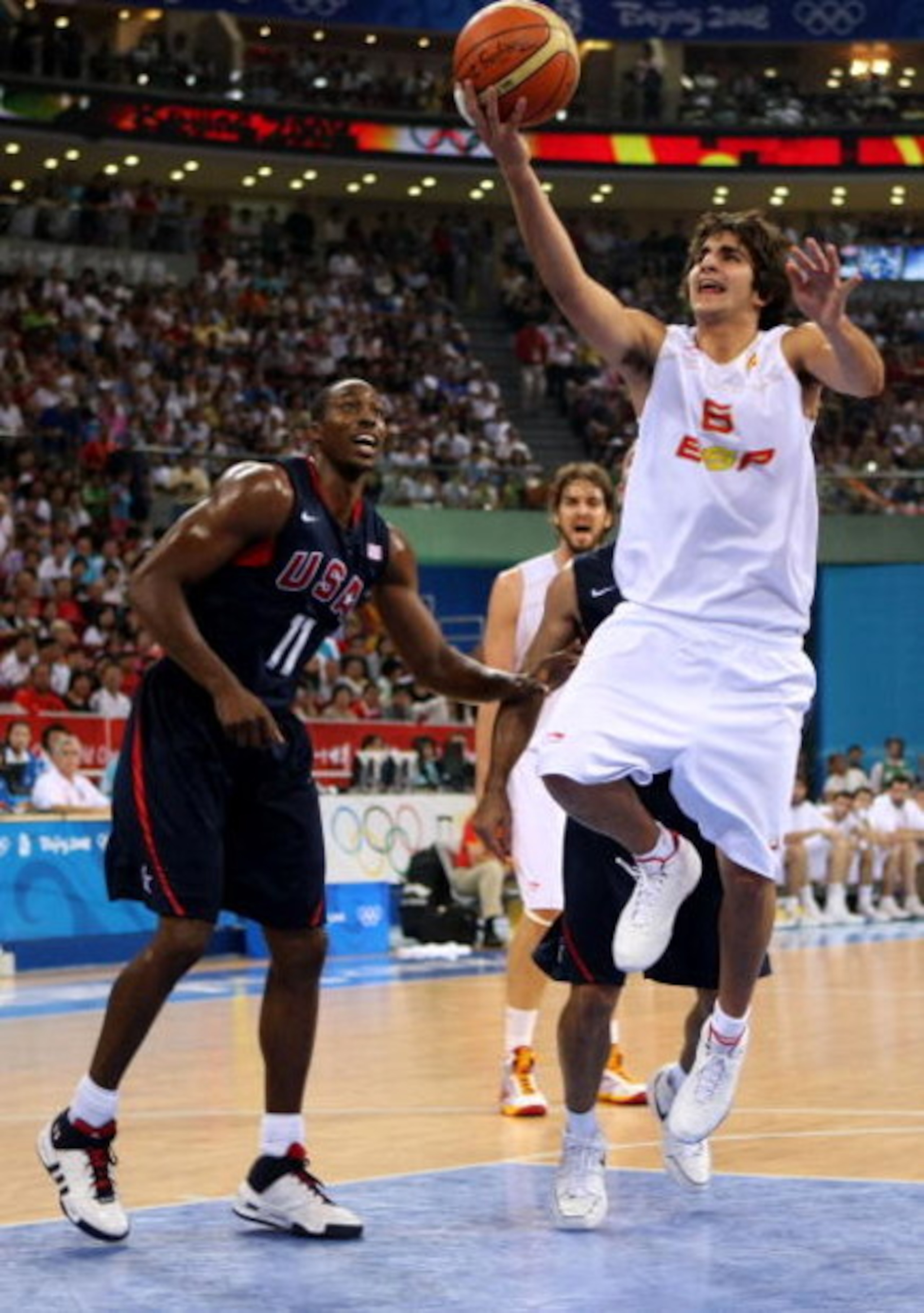 BEIJING - AUGUST 24: Ricky Rubio #6 of Spain lays the ball up past Dwight Howard #11 of the United States in the gold medal game during Day 16 of the Beijing 2008 Olympic Games at the Beijing Olympic Basketball Gymnasium on August 24, 2008 in Beijing, Ch BEIJING - AUGUST 24: Ricky Rubio #6 of Spain lays the ball up past Dwight Howard #11 of the United States in the gold medal game during Day 16 of the Beijing 2008 Olympic Games at the Beijing Olympic Basketball Gymnasium on August 24, 2008 in Beijing, Ch