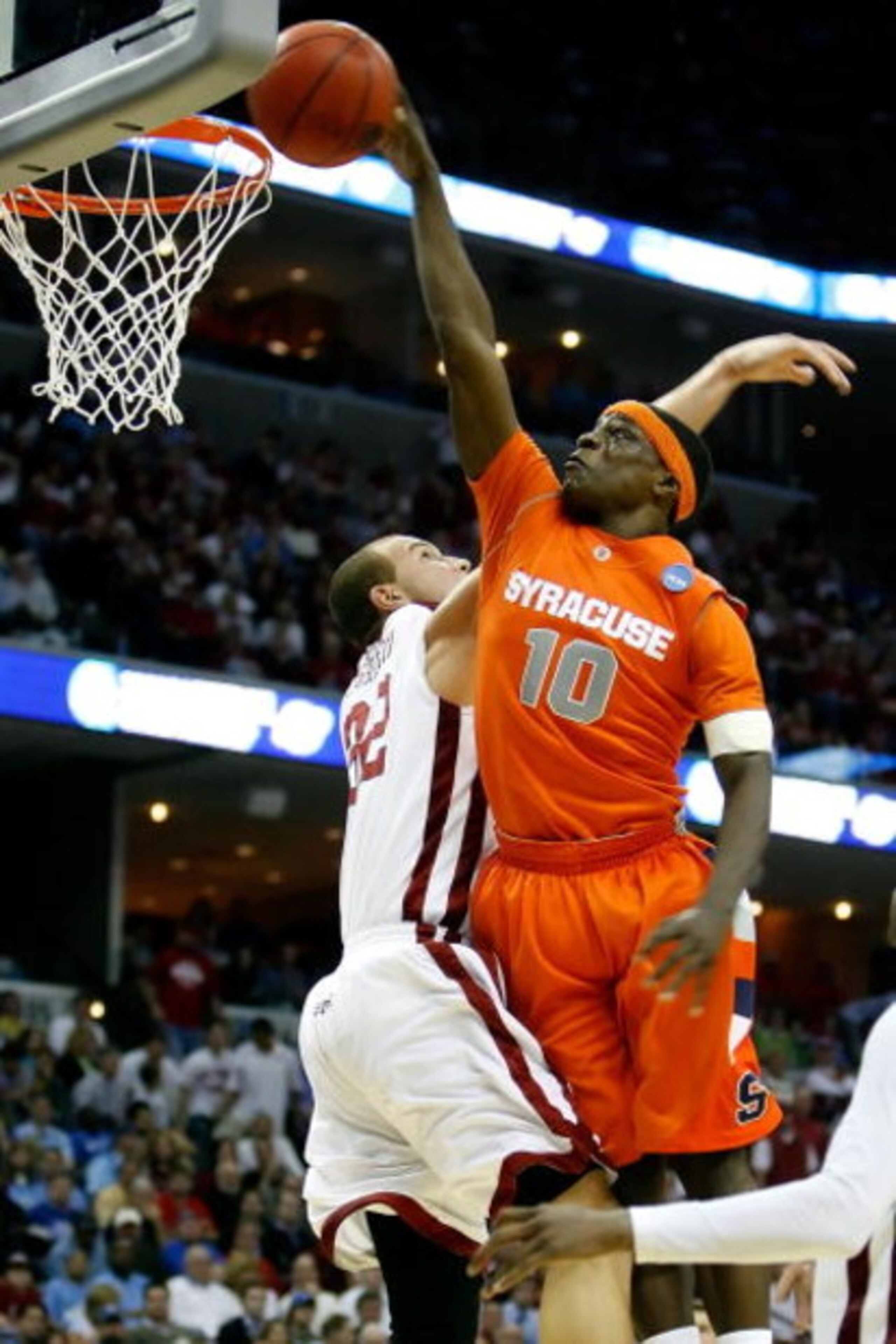 MEMPHIS, TN - MARCH 27: Jonny Flynn #10 of the Syracuse Orange goes up for a dunk over Taylor Griffin #32 of the Oklahoma Sooners in the second half during the NCAA Men's Basketball Tournament South Regionals at the FedExForum on March 27, 2009 in Memphi MEMPHIS, TN - MARCH 27: Jonny Flynn #10 of the Syracuse Orange goes up for a dunk over Taylor Griffin #32 of the Oklahoma Sooners in the second half during the NCAA Men's Basketball Tournament South Regionals at the FedExForum on March 27, 2009 in Memphi