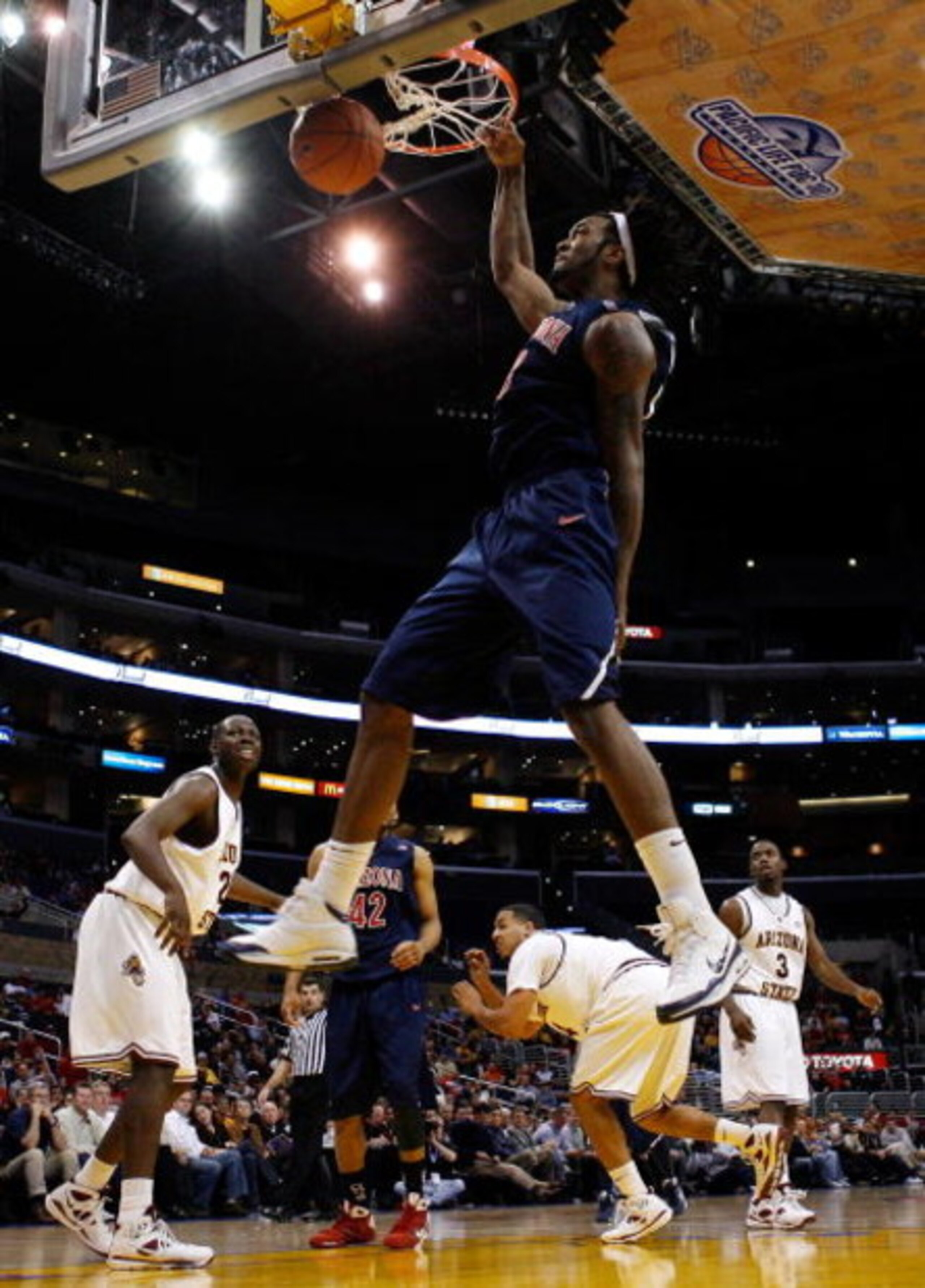 LOS ANGELES, CA - MARCH 12: Forward Jordan Hill #43 of the Arizona Wildcats dunks the ball against the Arizona State Sun Devils during the Pacific Life Pac-10 Men's Basketball Tournament at the Staples Center on March 12, 2009 in Los Angeles, California. LOS ANGELES, CA - MARCH 12: Forward Jordan Hill #43 of the Arizona Wildcats dunks the ball against the Arizona State Sun Devils during the Pacific Life Pac-10 Men's Basketball Tournament at the Staples Center on March 12, 2009 in Los Angeles, California.