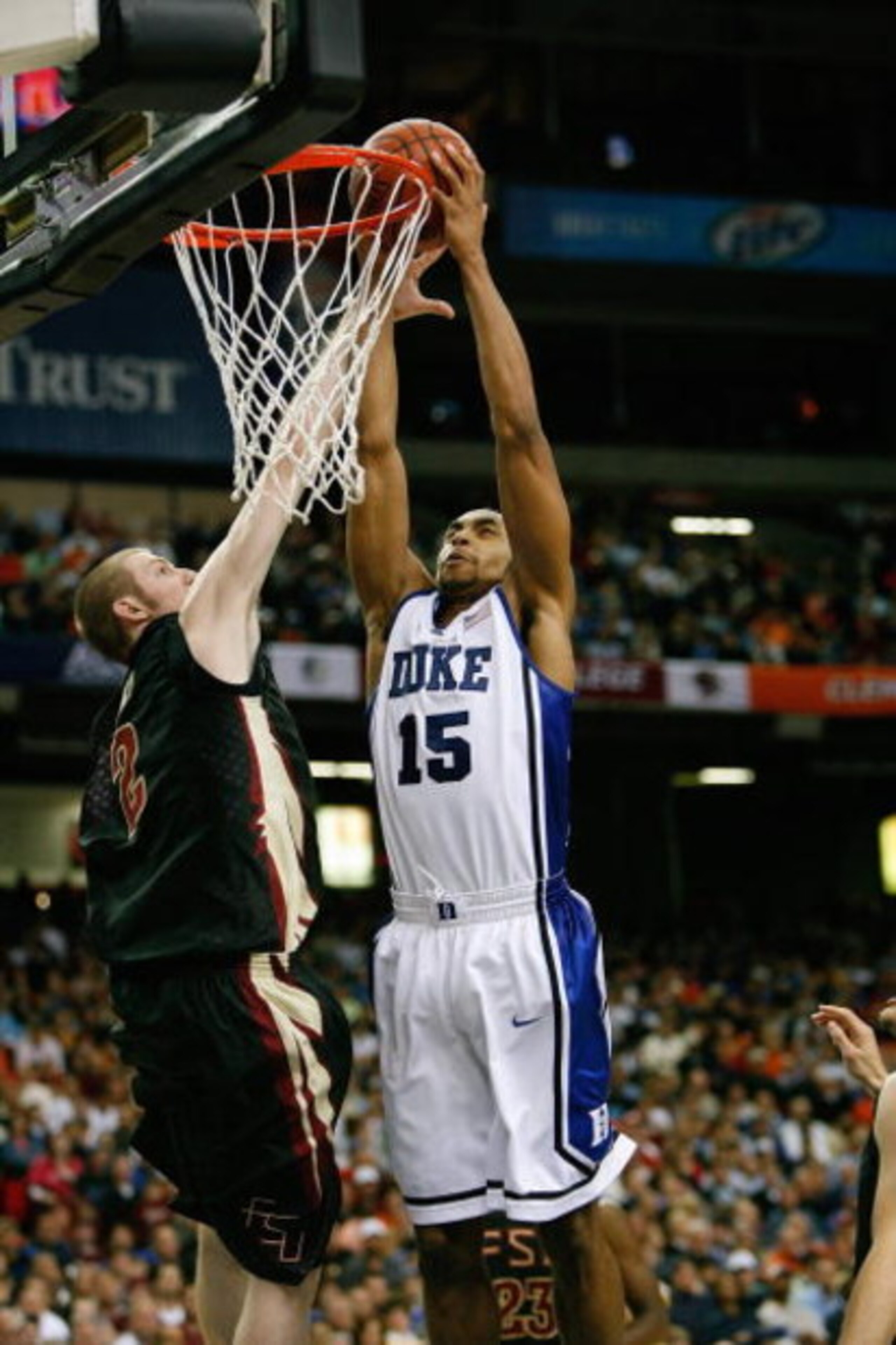 ATLANTA - MARCH 15: Gerald Henderson #15 of the Duke Blue Devils goes for the dunk against Jordan DeMercy #2 of the Florida State Seminoles during the championship game of the 2009 ACC Men's Basketball Tournament on March 15, 2009 at the Georgia Dome in ATLANTA - MARCH 15: Gerald Henderson #15 of the Duke Blue Devils goes for the dunk against Jordan DeMercy #2 of the Florida State Seminoles during the championship game of the 2009 ACC Men's Basketball Tournament on March 15, 2009 at the Georgia Dome in