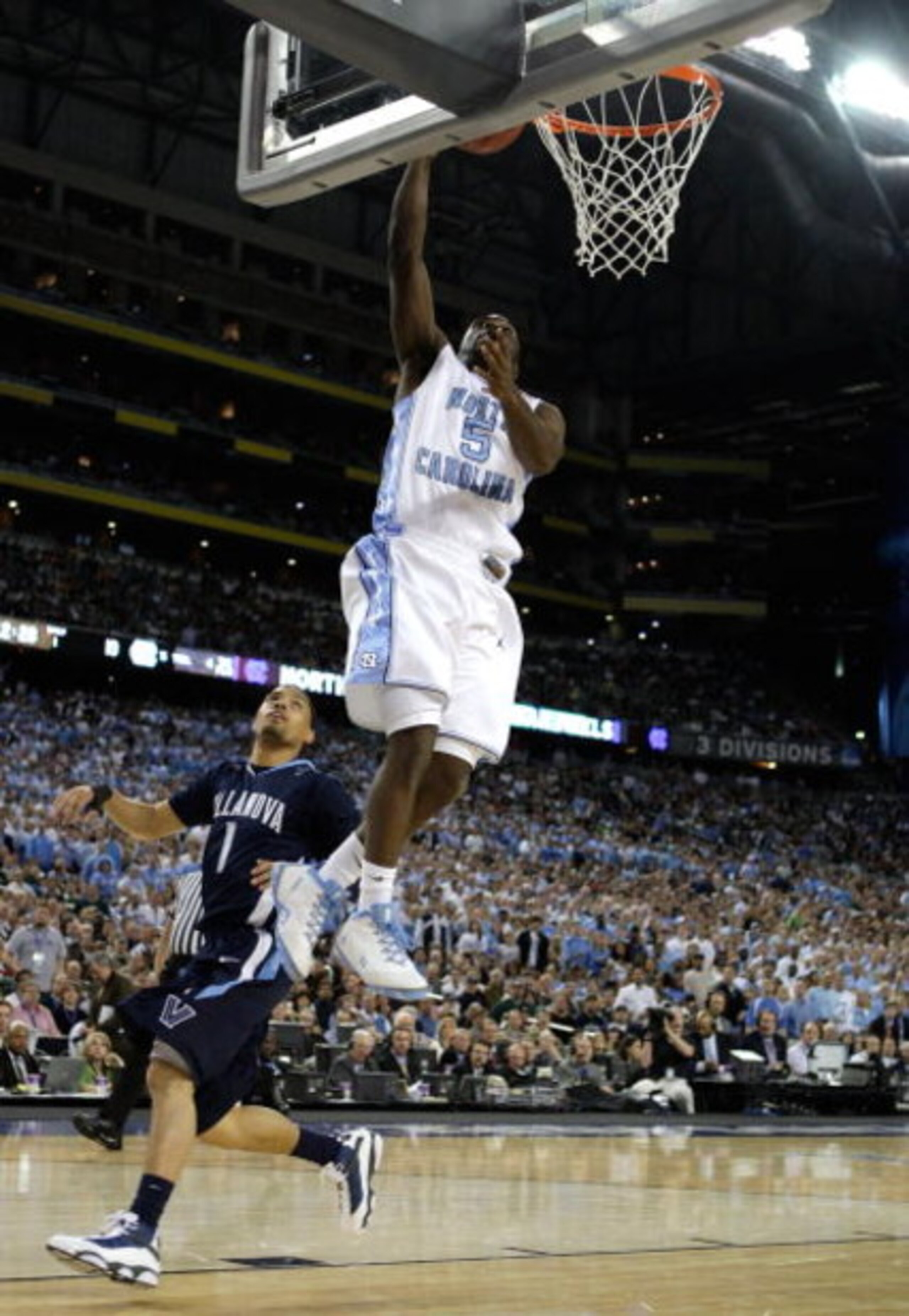 DETROIT - APRIL 04: Ty Lawson #5 of the North Carolina Tar Heels shoots a lay up in the first half against Scottie Reynolds #1 of the Villanova Wildcats during the National Semifinal game of the NCAA Division I Men's Basketball Championship at Ford Field DETROIT - APRIL 04: Ty Lawson #5 of the North Carolina Tar Heels shoots a lay up in the first half against Scottie Reynolds #1 of the Villanova Wildcats during the National Semifinal game of the NCAA Division I Men's Basketball Championship at Ford Field