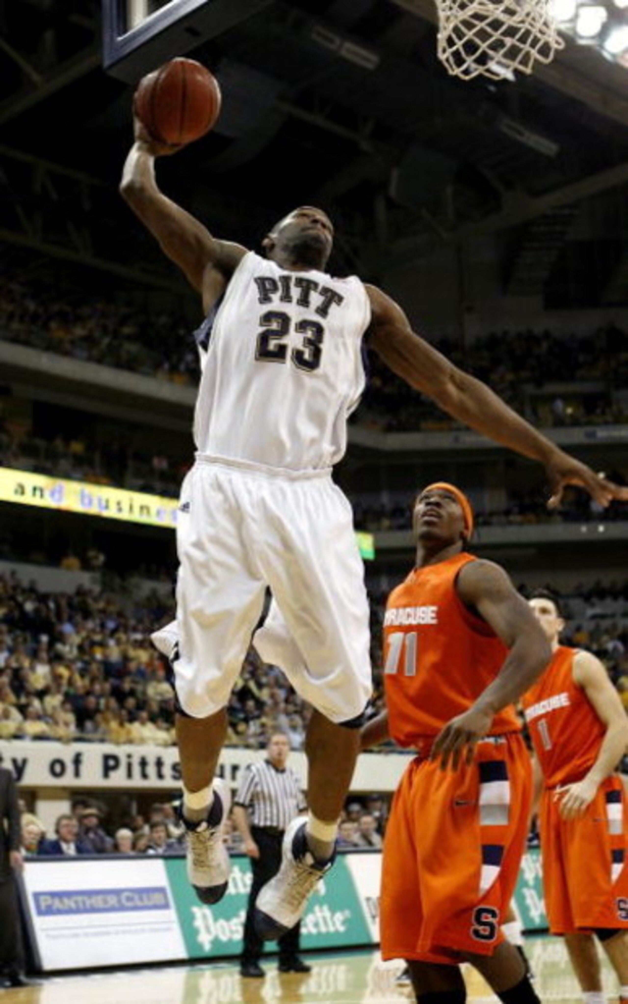 PITTSBURGH - JANUARY 19: Sam Young #23 of the Pittsburgh Panthers gets in for a second half dunk in front of Paul Harris #11 of the Syracuse Orange on January 19, 2009 at the Petersen Events Center in Pittsburgh, Pennsylvania. Pittsburgh won the game 78-6 PITTSBURGH - JANUARY 19: Sam Young #23 of the Pittsburgh Panthers gets in for a second half dunk in front of Paul Harris #11 of the Syracuse Orange on January 19, 2009 at the Petersen Events Center in Pittsburgh, Pennsylvania. Pittsburgh won the game 78-6