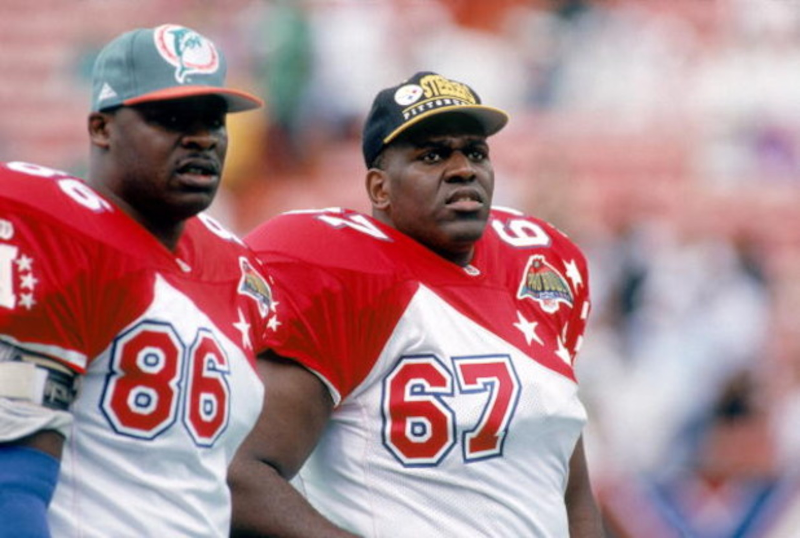 HONOLULU, HI - FEBRUARY 5:  Miami Dolphins tight end Keith Jackson #86 and Pittsburgh Steelers Duval Love #67 of the AFC team watch the action from the sidelines during the 1995 NFL Pro Bowl at Aloha Stadium on February 5, 1995 in Honolulu, Hawaii.  The A
