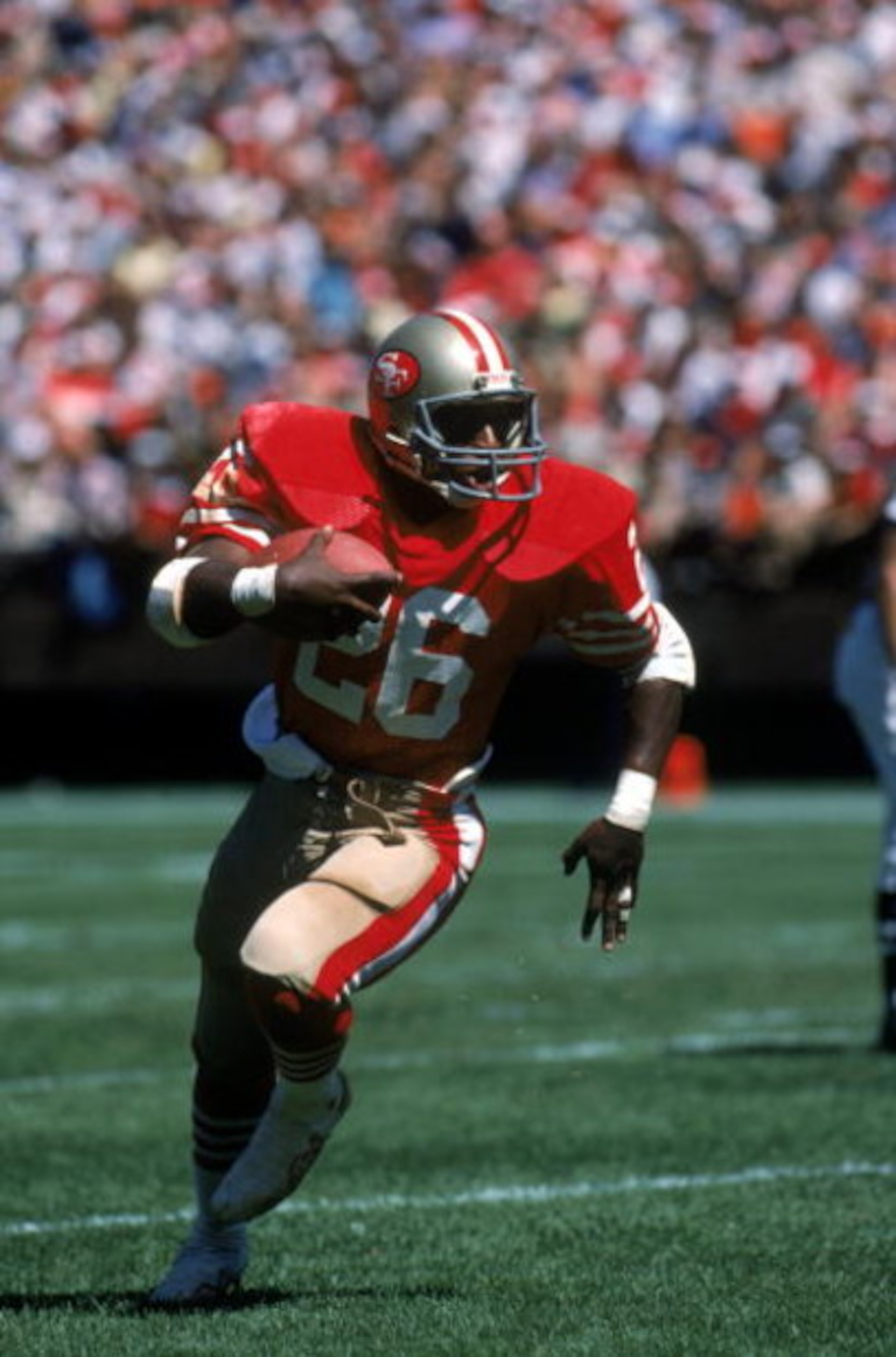 SAN FRANCISCO - SEPTEMBER 16:  Running back Wendell Tyler #26 of the San Francisco 49ers runs with the ball during a game against the New Orleans Saints at Candlestick Park on September 16, 1984 in San Francisco, California.  The 49ers won 30-20.  (Photo 