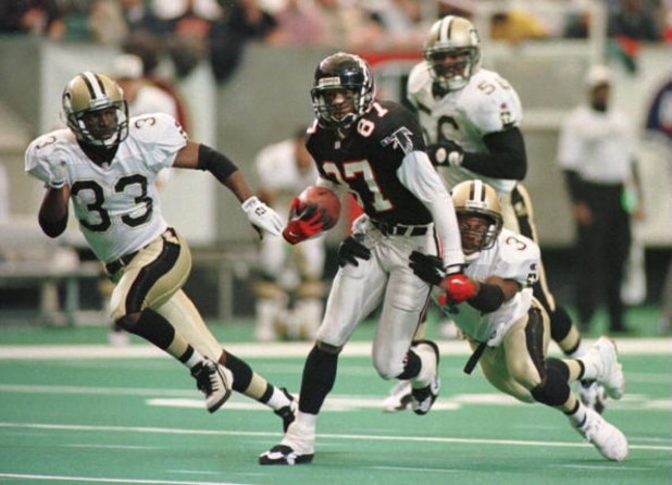 10 DEC 1995: NEW ORLEANS SAINTS DEFENDERS TYRONE HUGHES #33, ERNEST DIXON #56 AND JIMMY SPENCER #37 ATTEMPT TO STOP ATLANTA FALCONS WIDE RECEIVER BERT EMANUEL #87 IN THE SECOND QUARTER AT THE GEORGIA DOME IN ATLANTA, GEORGIA. Mandatory Credit: Matthew S 10 DEC 1995: NEW ORLEANS SAINTS DEFENDERS TYRONE HUGHES #33, ERNEST DIXON #56 AND JIMMY SPENCER #37 ATTEMPT TO STOP ATLANTA FALCONS WIDE RECEIVER BERT EMANUEL #87 IN THE SECOND QUARTER AT THE GEORGIA DOME IN ATLANTA, GEORGIA. Mandatory Credit: Matthew S