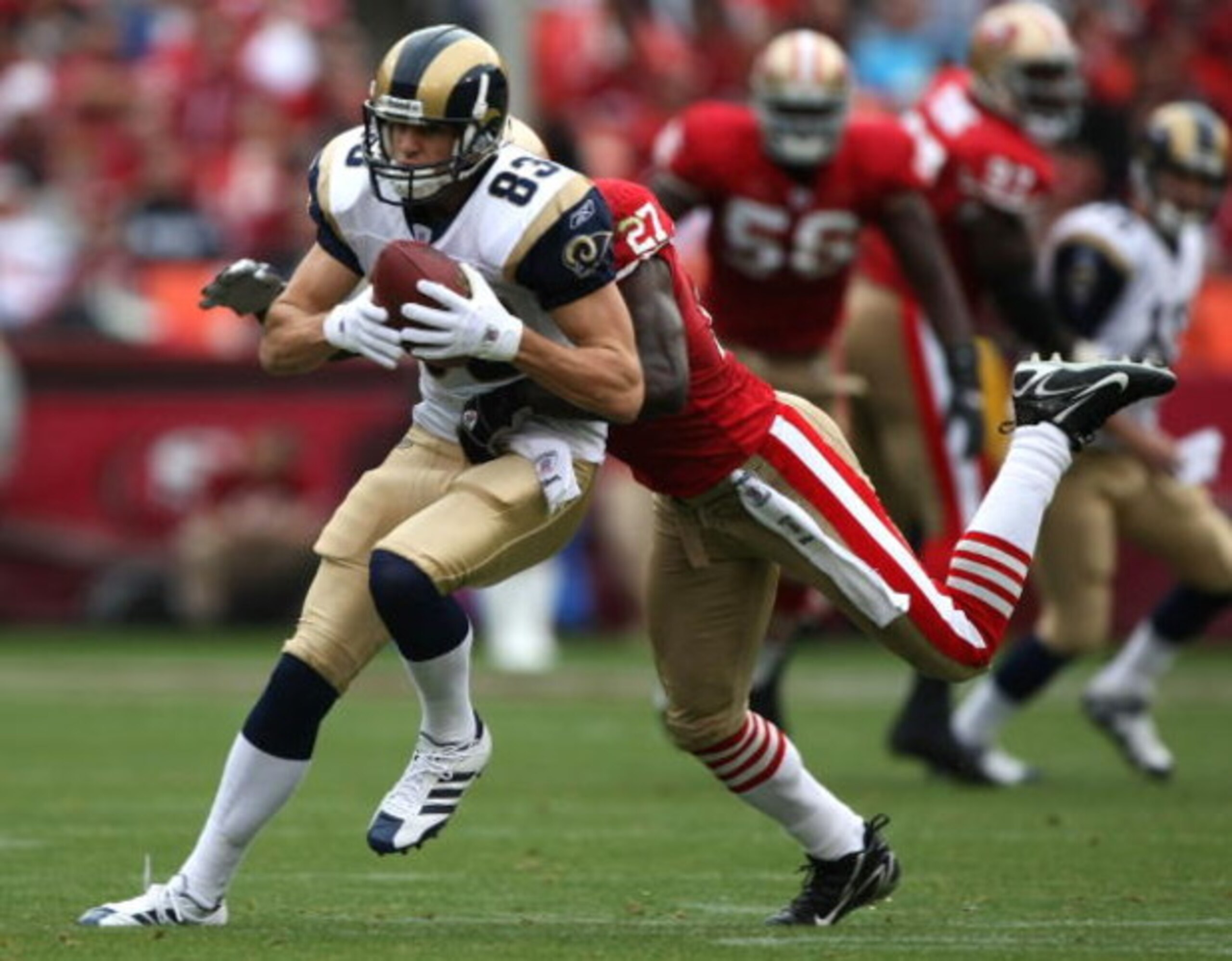 SAN FRANCISCO - NOVEMBER 18:  Drew Bennett #83 of the St. Louis Rams catches a pass over Walt Harris #27 of the San Francisco 49ers at Monster Park November 18, 2007 in San Francisco, California.  (Photo by Jed Jacobsohn/Getty Images)