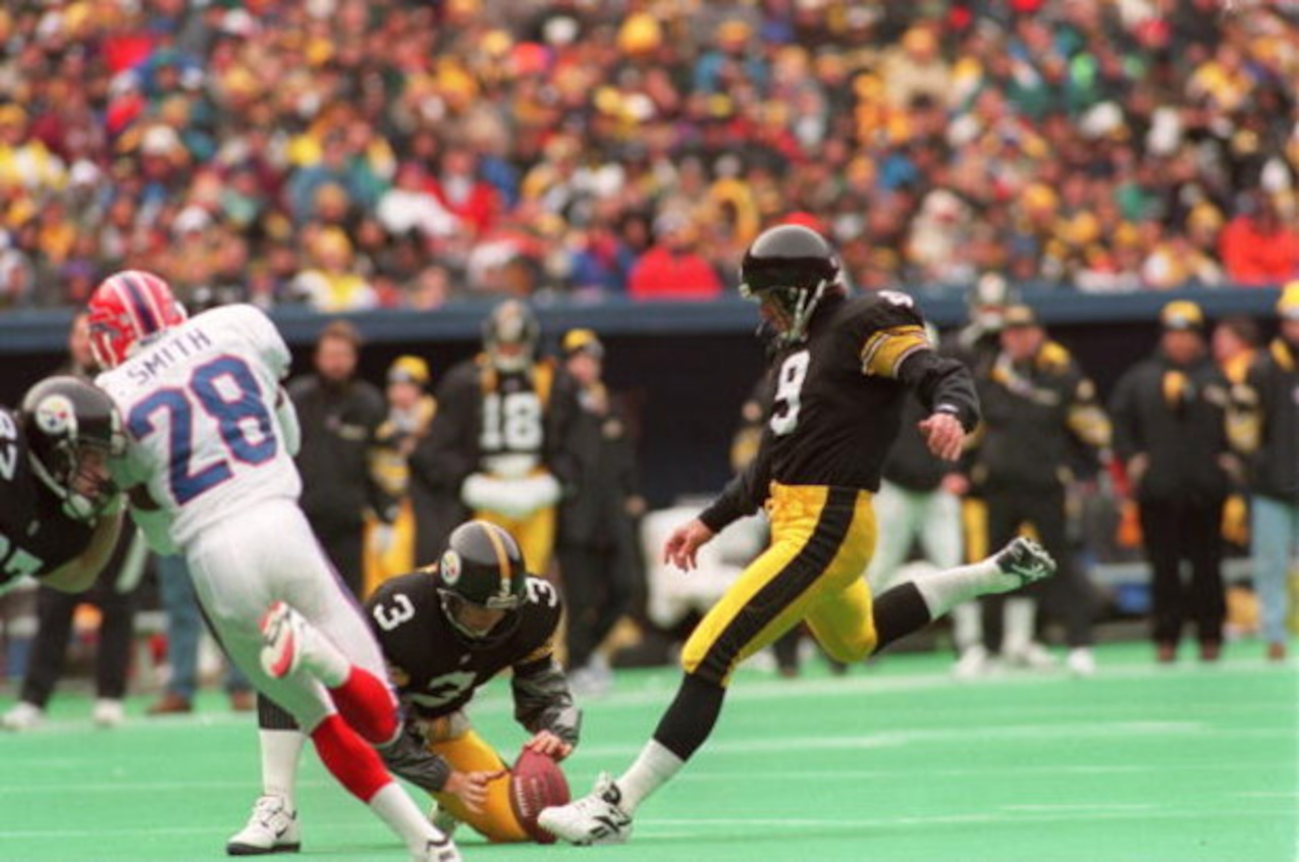 6 Jan 1996: Kicker Norm Johnson #9 of the Pittsburgh Steelers focuses on the ball just before impact on a field goal attempt during the Steelers 40-21 AFC Divisional Playoff victory over the Buffalo Bills at Three Rivers Stadium in Pittsburgh, Pennsylvani