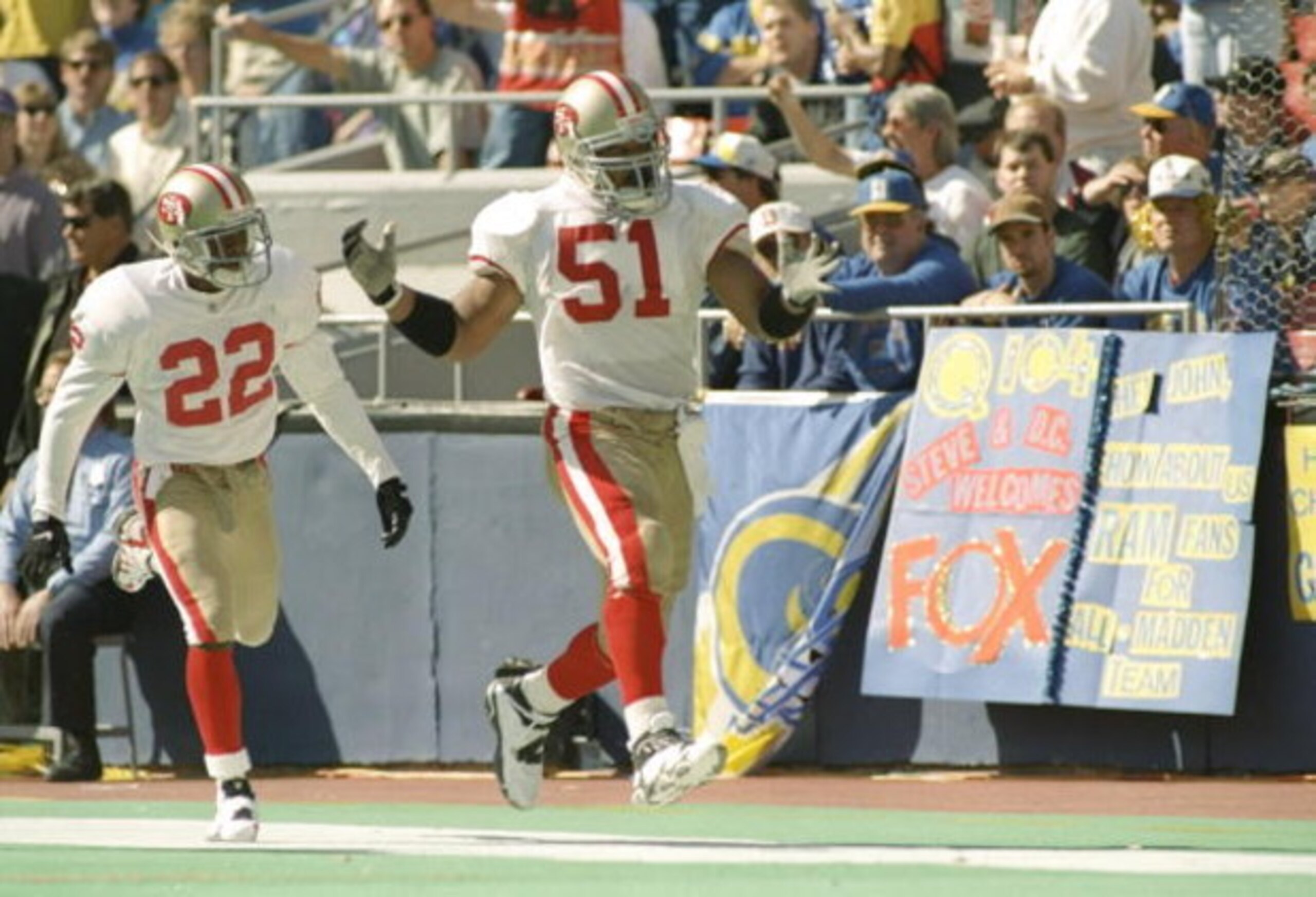 22 Oct 1995:  Cornerback Tyronne Drakeford and linebacker Ken Norton of the San Francisco 49ers celebrate during the game against the St. Louis Rams at Busch Stadium in St. Louis, Missouri.  The 49ers won the game 44-10. Mandatory Credit: Jamie Squire  /A