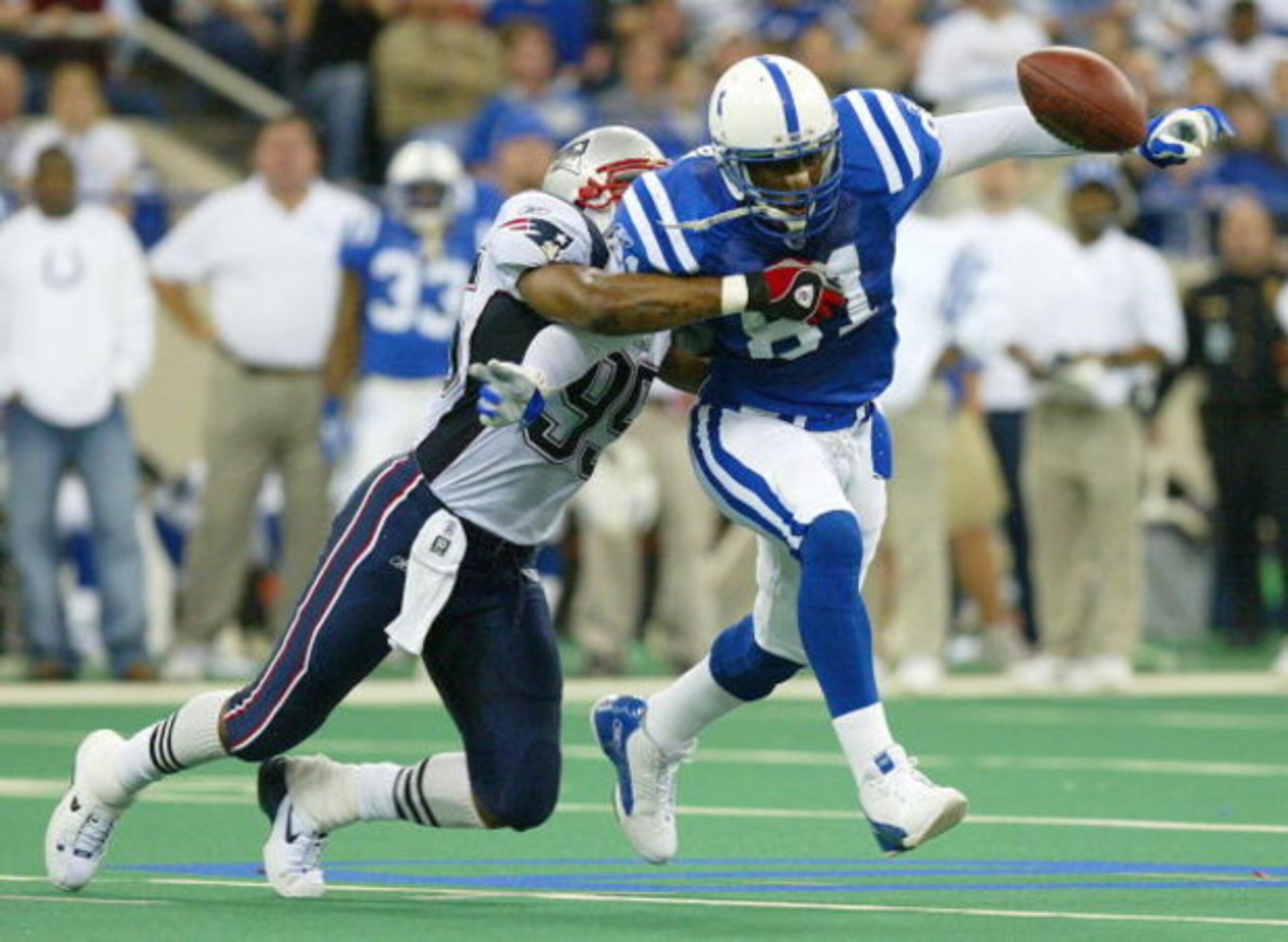 INDIANAPOLIS - NOVEMBER 30:  Marcus Pollard #81 of the Indianapolis Colts cannot control a pass intended for him while defended by Roman Phifer #95 of the New England Partiots on November 30, 2003 at the RCA Dome in Indianapolis, Indiana.  (Photo by Andy 