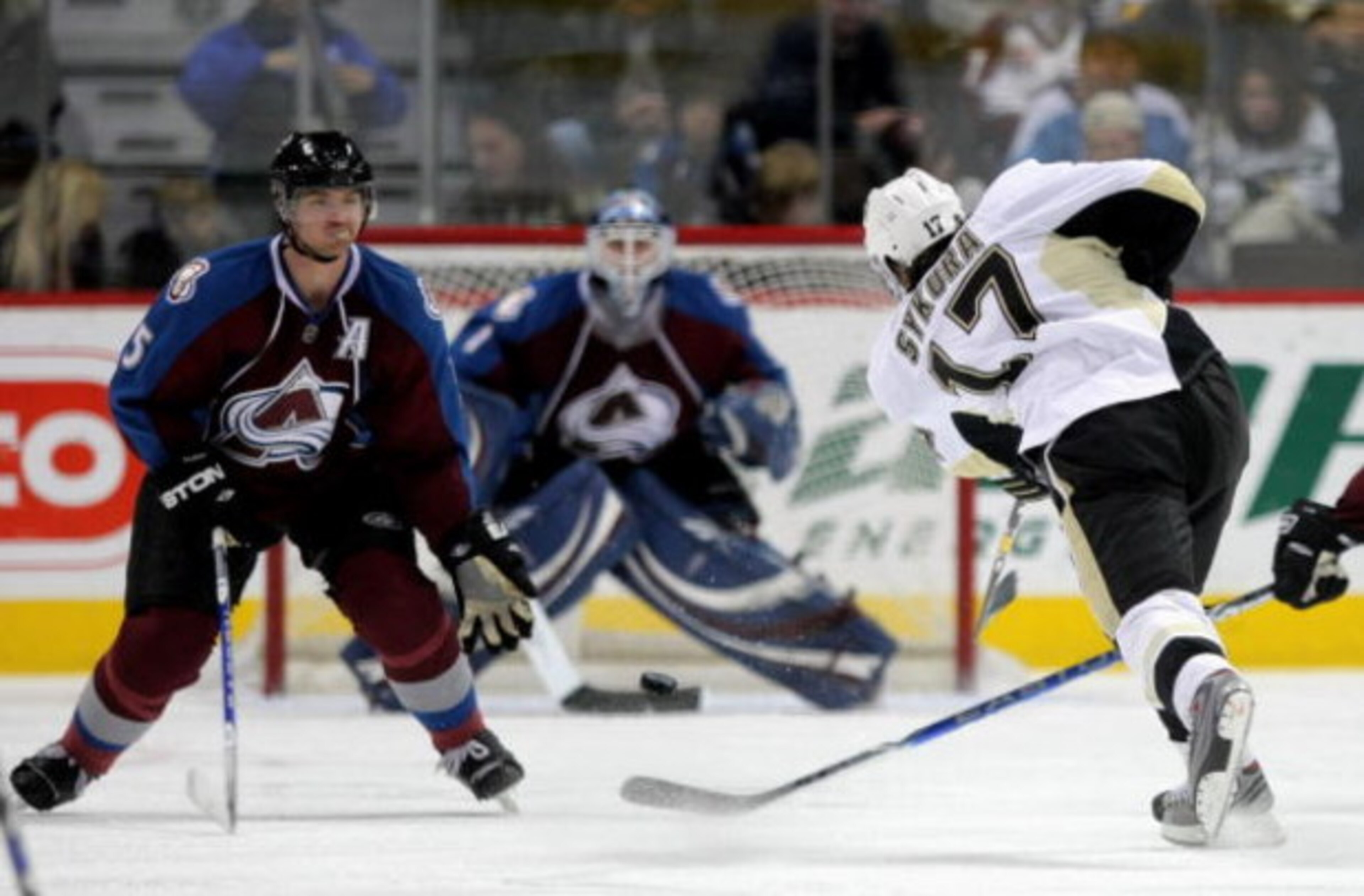 DENVER - JANUARY 10:  Petr Sykora #17 of the Pittsburgh Penguins takes a shot past Brett Clark #5 as goaltender Andrew Raycroft #1 the Colorado Avalanche defends the goal during NHL action at the Pepsi Center on January 10, 2009 in Denver, Colorado. The A