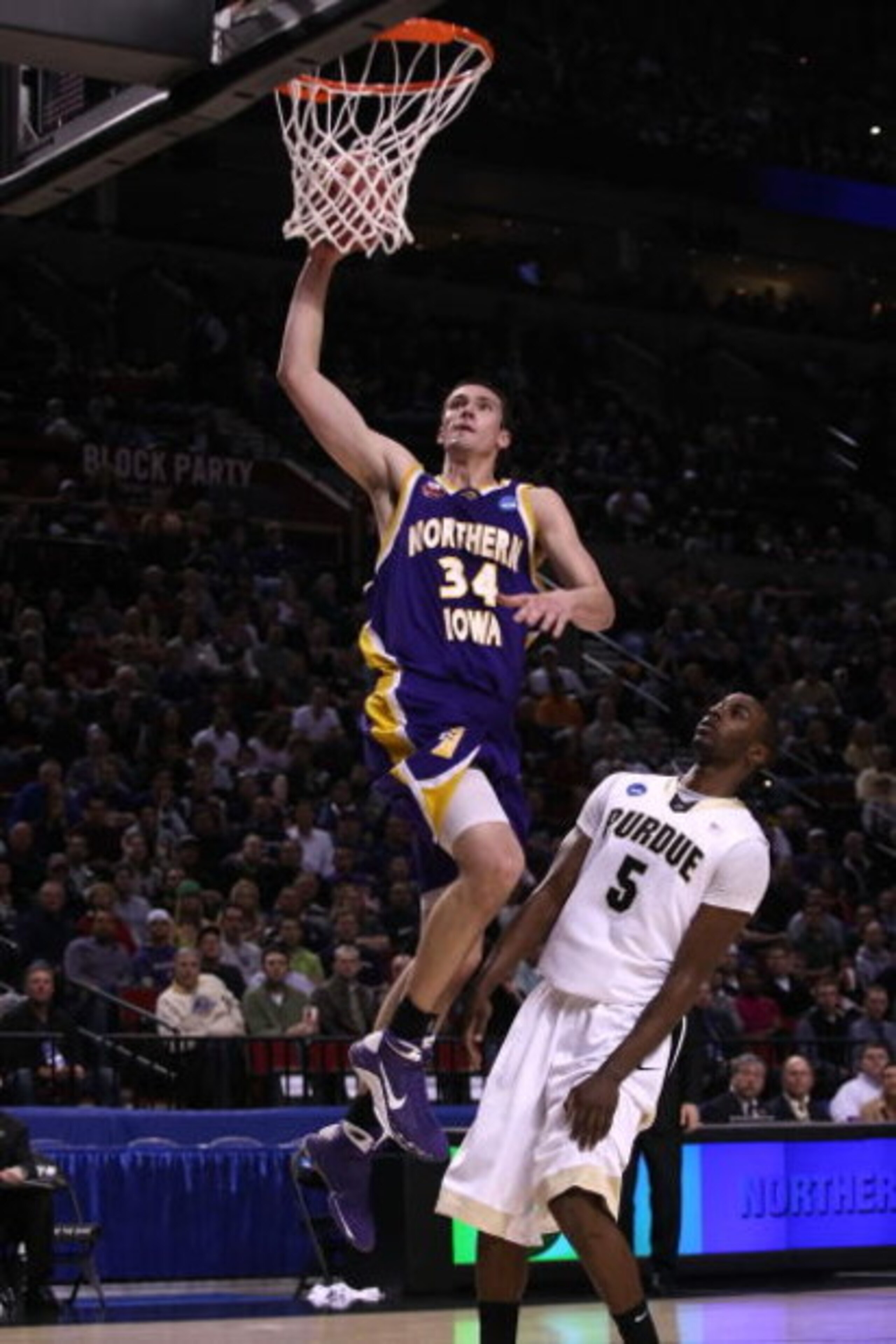 PORTLAND, OR - MARCH 19:  Adam Koch #34 of the Northern Iowa Panthers goes up for a dunk in front of Keaton Grant #5 of the Purdue Boilermakers in the second half during the first round of the NCAA Division I Men's Basketball Tournament at the Rose Garden
