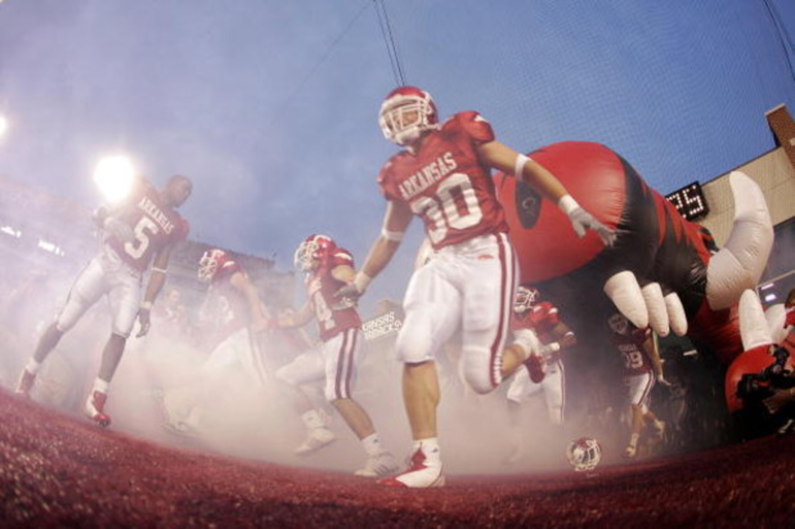 FAYETTEVILLE, AR - SEPTEMBER 02:  Tailback Darren McFadden #5 of the Arkansas Razorbacks turns around to retrieve his helmet after hitting his head on the roof of the hog's mouth while running onto the field for a game against the University of Southern C