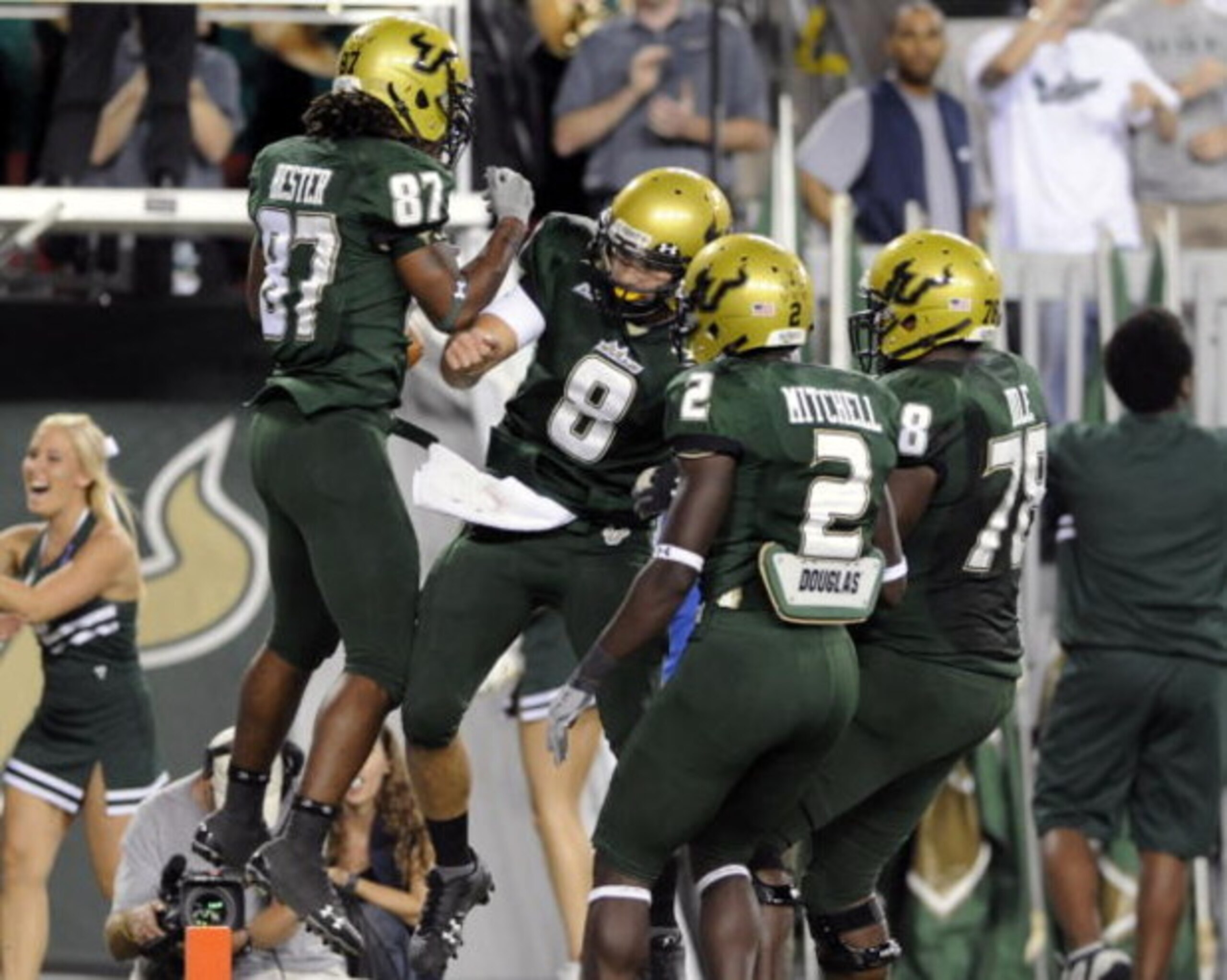 TAMPA, FL - OCTOBER 2:  Wide receiver Jessie Hester #87 of the University of South Florida Bulls celebrates a fourth-quarter touchdown pass with quarterback Matt Grothe #8 against the Pittsburgh Panthers at Raymond James Stadium on October 2, 2008 in Tamp