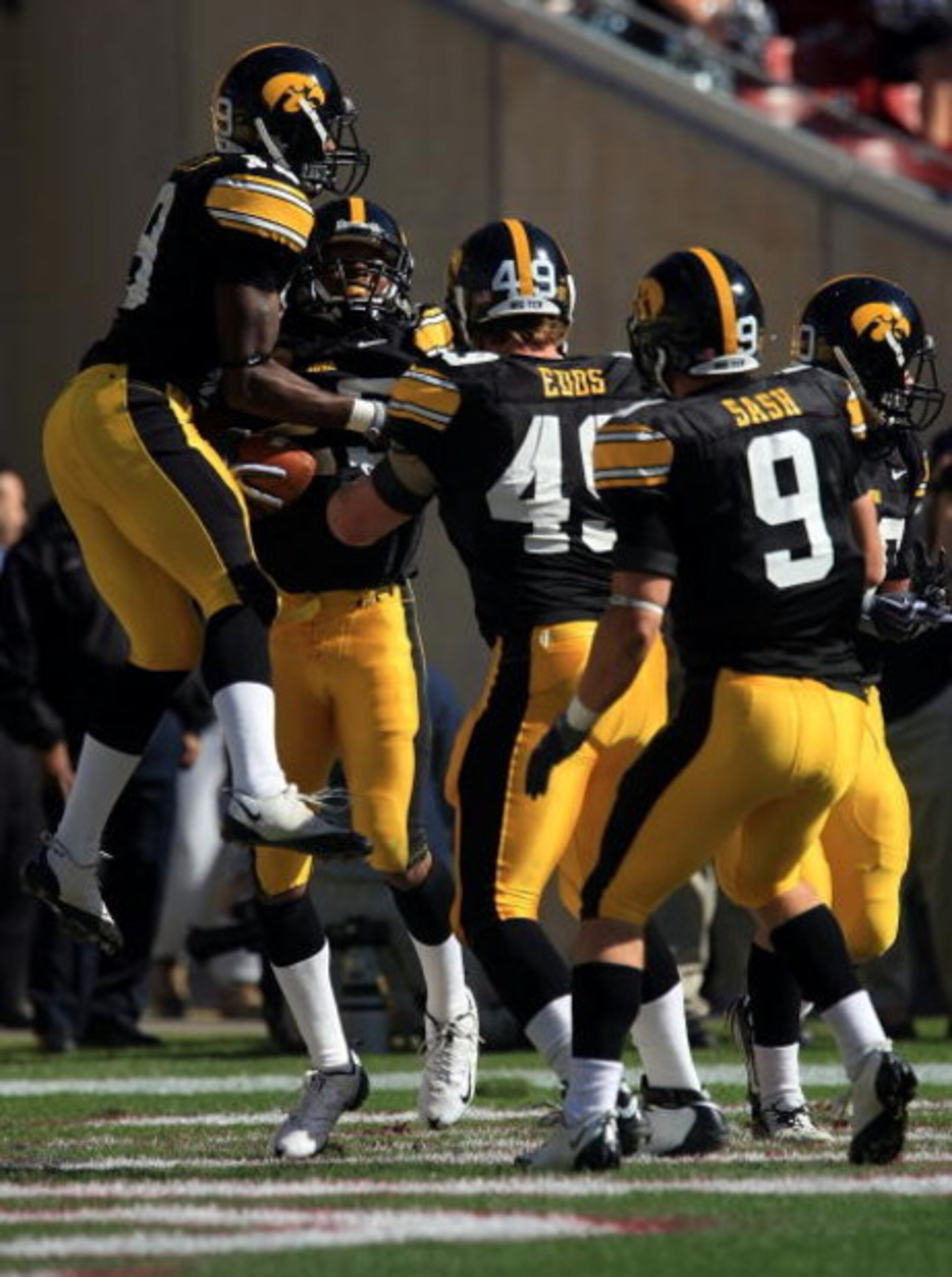 TAMPA, FL - JANUARY 01:   The Iowa Hawkeyes celebrate after an interception by Paki O'Meara #25 against the South Carolina Gamecocks during the Outback Bowl on January 1, 2009 at Raymond James Stadium in Tampa, Florida.  (Photo by Scott Halleran/Getty Ima