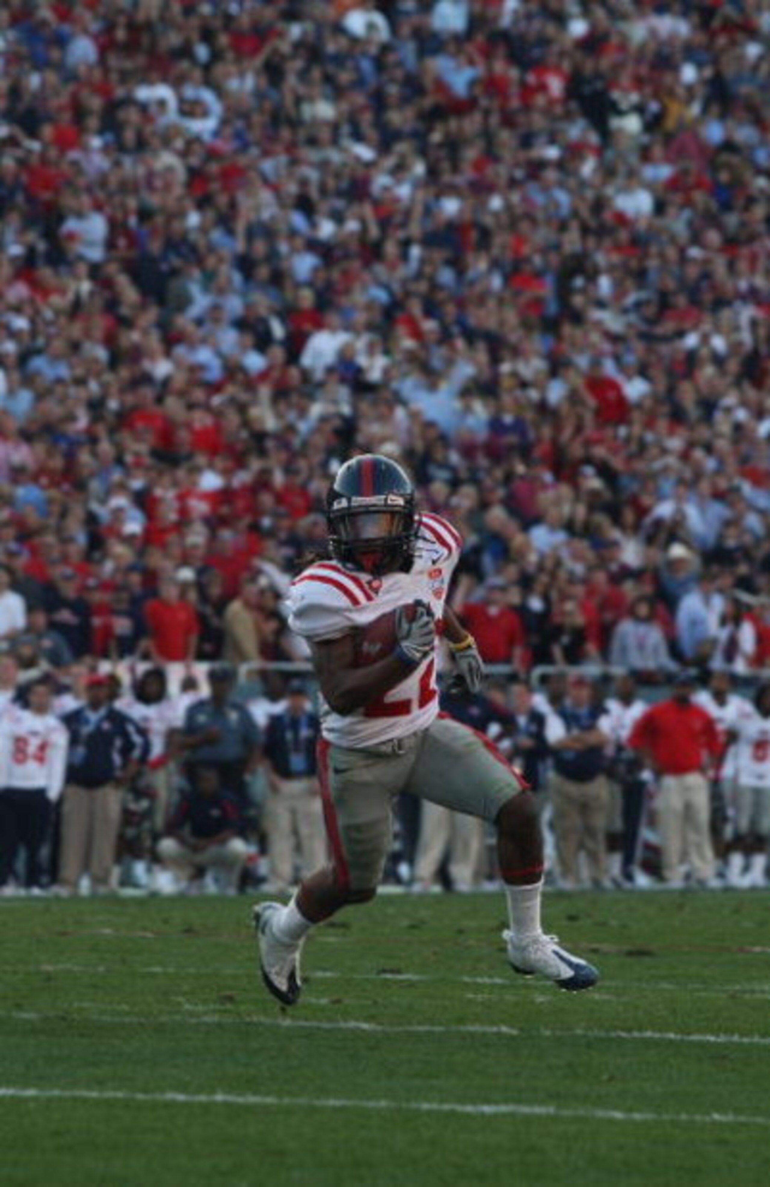 DALLAS - JANUARY 02:  Wide receiver Dexter McCluster #22 of the Mississippi Rebels runs the ball against the Texas Tech Red Raiders during the AT&T Cotton Bowl on January 2, 2009 at the Cotton Bowl in Dallas, Texas.  (Photo by Ronald Martinez/Getty Images