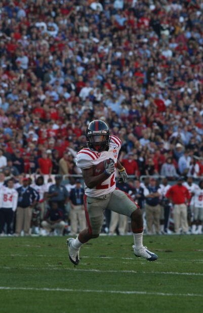 DALLAS - JANUARY 02:  Wide receiver Dexter McCluster #22 of the Mississippi Rebels runs the ball against the Texas Tech Red Raiders during the AT&T Cotton Bowl on January 2, 2009 at the Cotton Bowl in Dallas, Texas.  (Photo by Ronald Martinez/Getty Images