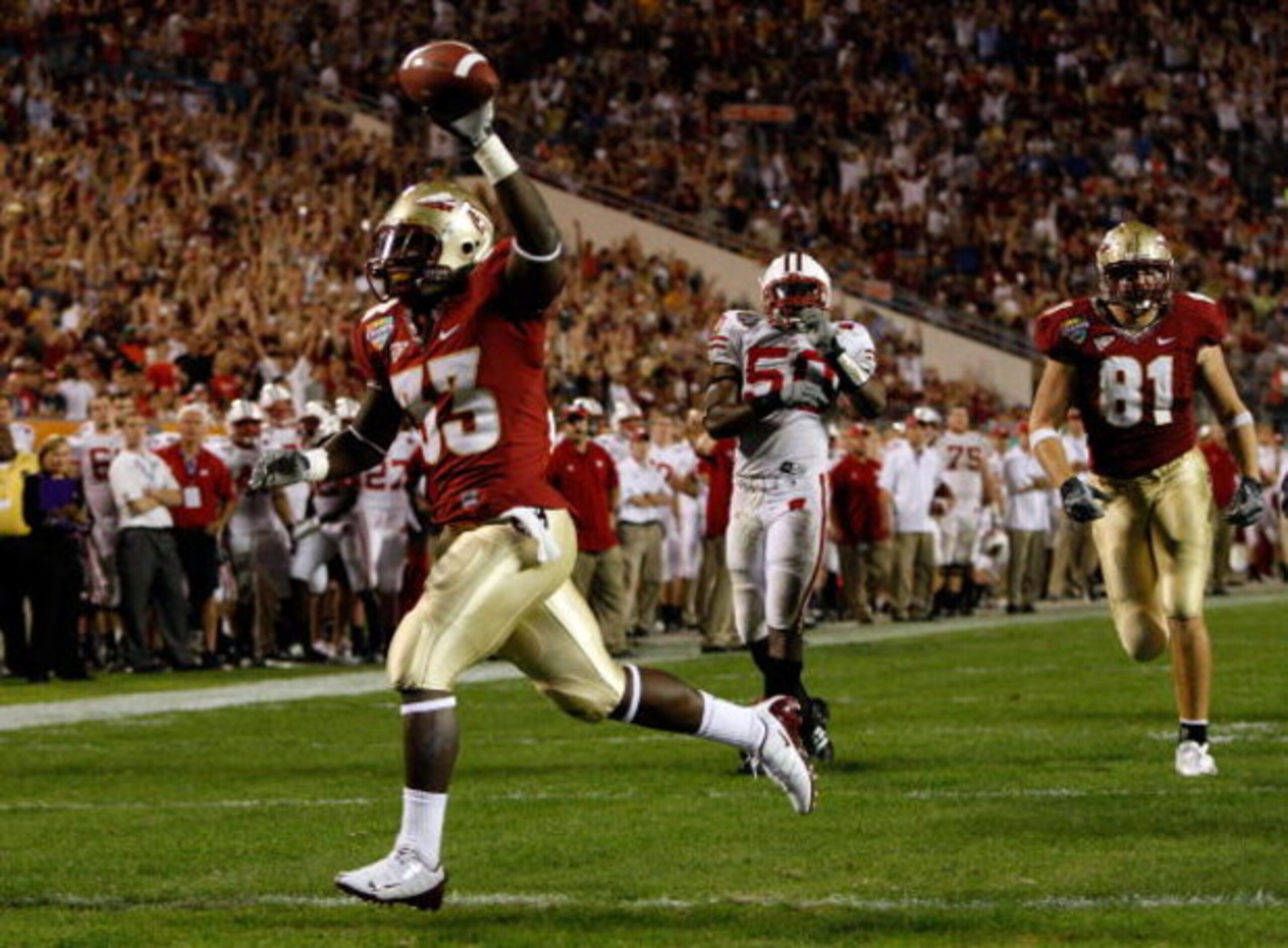 ORLANDO, FL - DECEMBER 27:  Carlton Jones #33 of the Florida State Seminoles scores a touchdown during the Champs Bowl against the Wisconsin Badgers on December 27, 2008 at the Citrus Bowl in Orlando, Florida.  (Photo by Sam Greenwood/Getty Images)