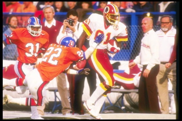 31 Jan 1988:  Defensive lineman Tony Lilly #22 of the Denver Broncos tries to stop wide receiver Art Monk #81 of the Washington Redskins during the Super Bowl XXII game at the Jack Murphy Stadium in San Diego, California.  The Redskins won, 42-10.  Mandat