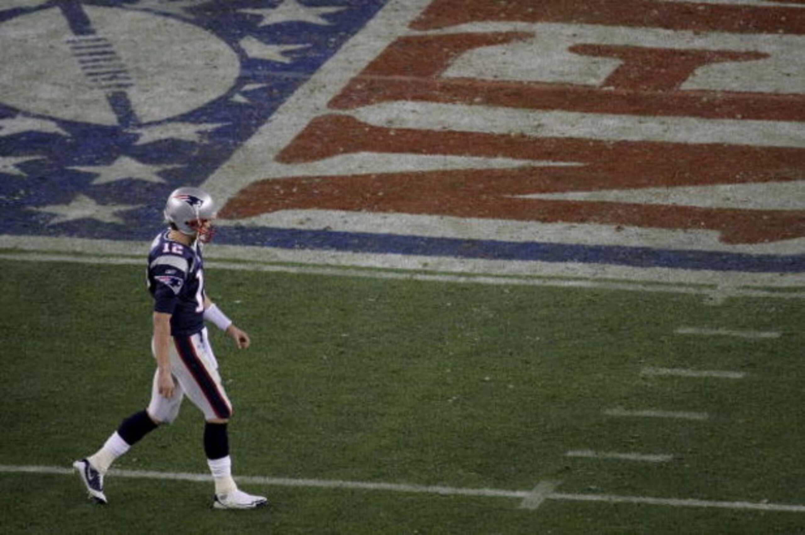 GLENDALE, AZ - FEBRUARY 03:  Tom Brady #12 of the New England Patriots walks off the field against the New York Giants in Super Bowl XLII on February 3, 2008 at the University of Phoenix Stadium in Glendale, Arizona.  (Photo by Doug Pensinger/Getty Images