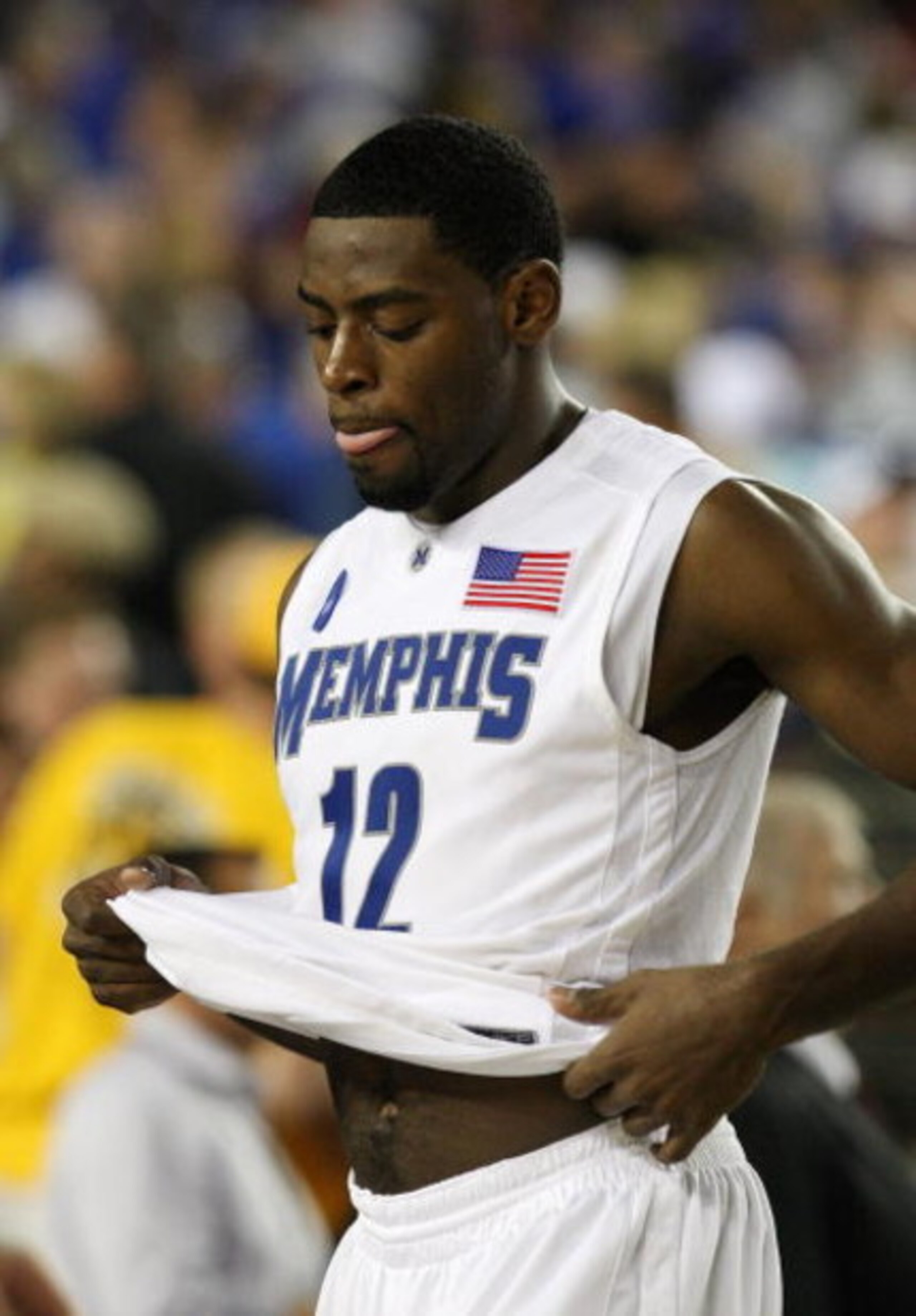 GLENDALE, AZ - MARCH 26:  Guard Tyreke Evans #12 of the Memphis Tigers walks off the court after losing to the Missouri Tigers in the Sweet 16 of the NCAA Division I Men's Basketball Tournament at the University of Phoenix Stadium on March 26, 2009 in Gle