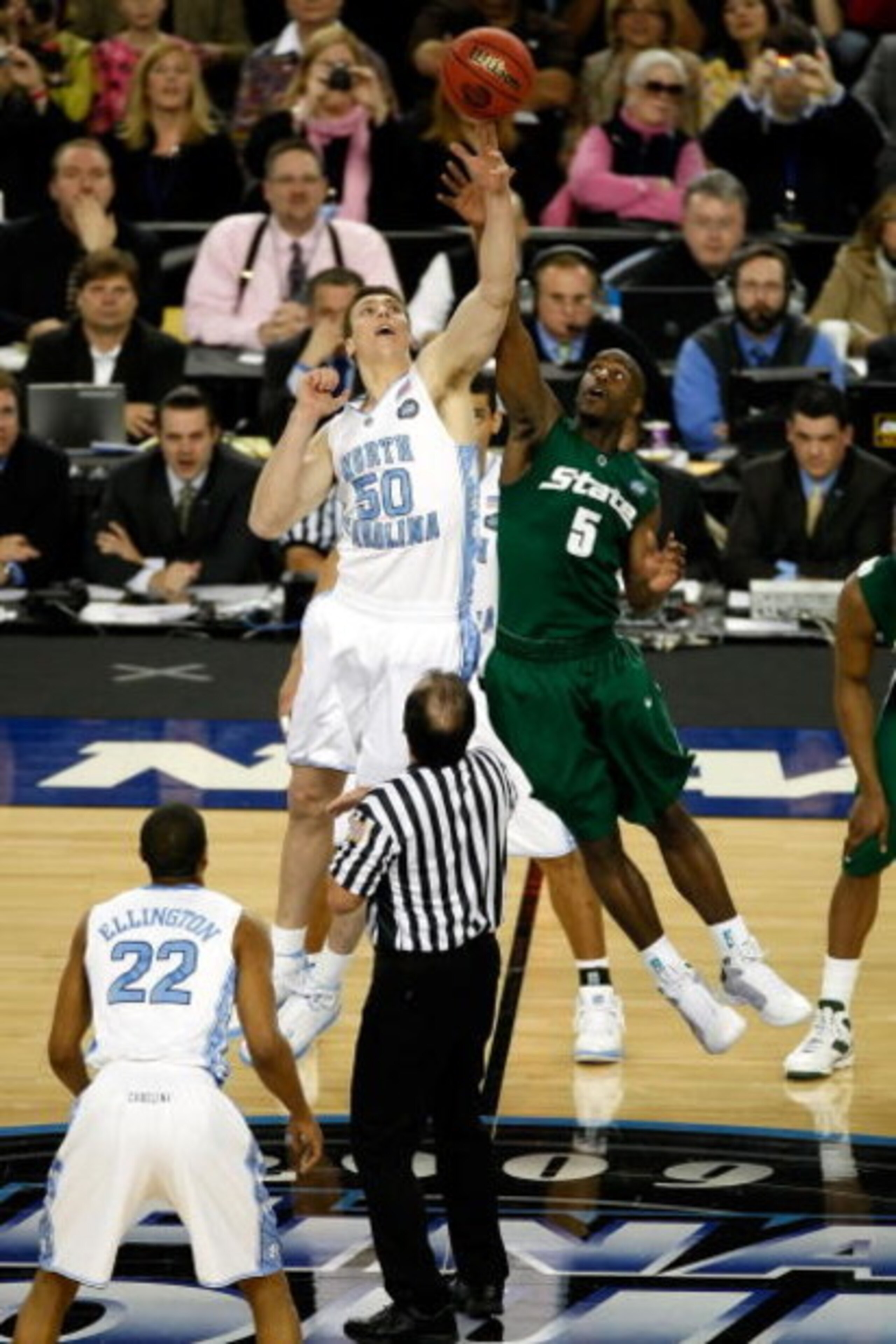 DETROIT - APRIL 06:  Travis Walton #5 of the Michigan State Spartans and Tyler Hansbrough #50 of the North Carolina Tar Heels go after a jump ball after the opening-tip had to be re-done during the 2009 NCAA Division I Men's Basketball National Championsh