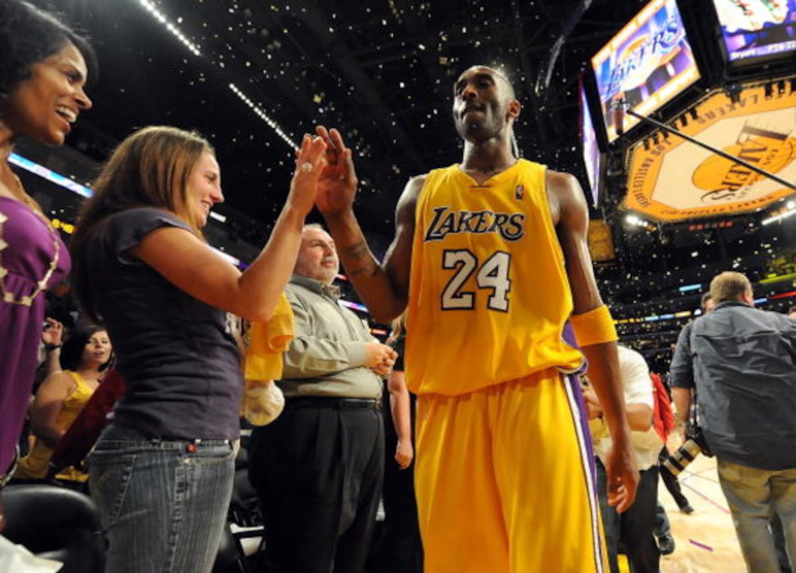 LOS ANGELES, CA - MAY 27:  Kobe Bryant #24 of the Los Angeles Lakers gives a fan a five after defeating the Denver Nuggets 103-94 in Game Five of the Western Conference Finals during the 2009 NBA Playoffs at Staples Center on May 27, 2009 in Los Angeles, 