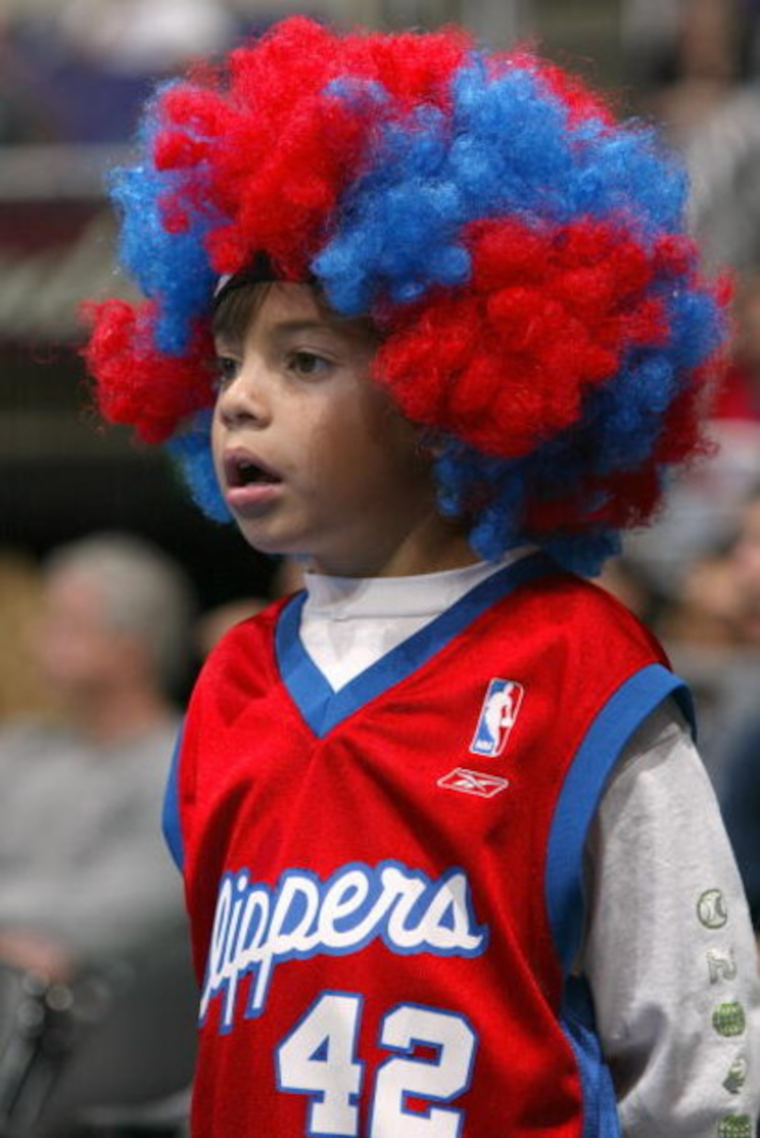 LOS ANGELES - OCTOBER 24:  A Los Angeles Clippers fan watches the action during a preseason game against the New Orleans Hornets on October 24, 2004 at Staples Center in Los Angeles, California. The Clippers won 97-93. NOTE TO USER: User expressly acknowl