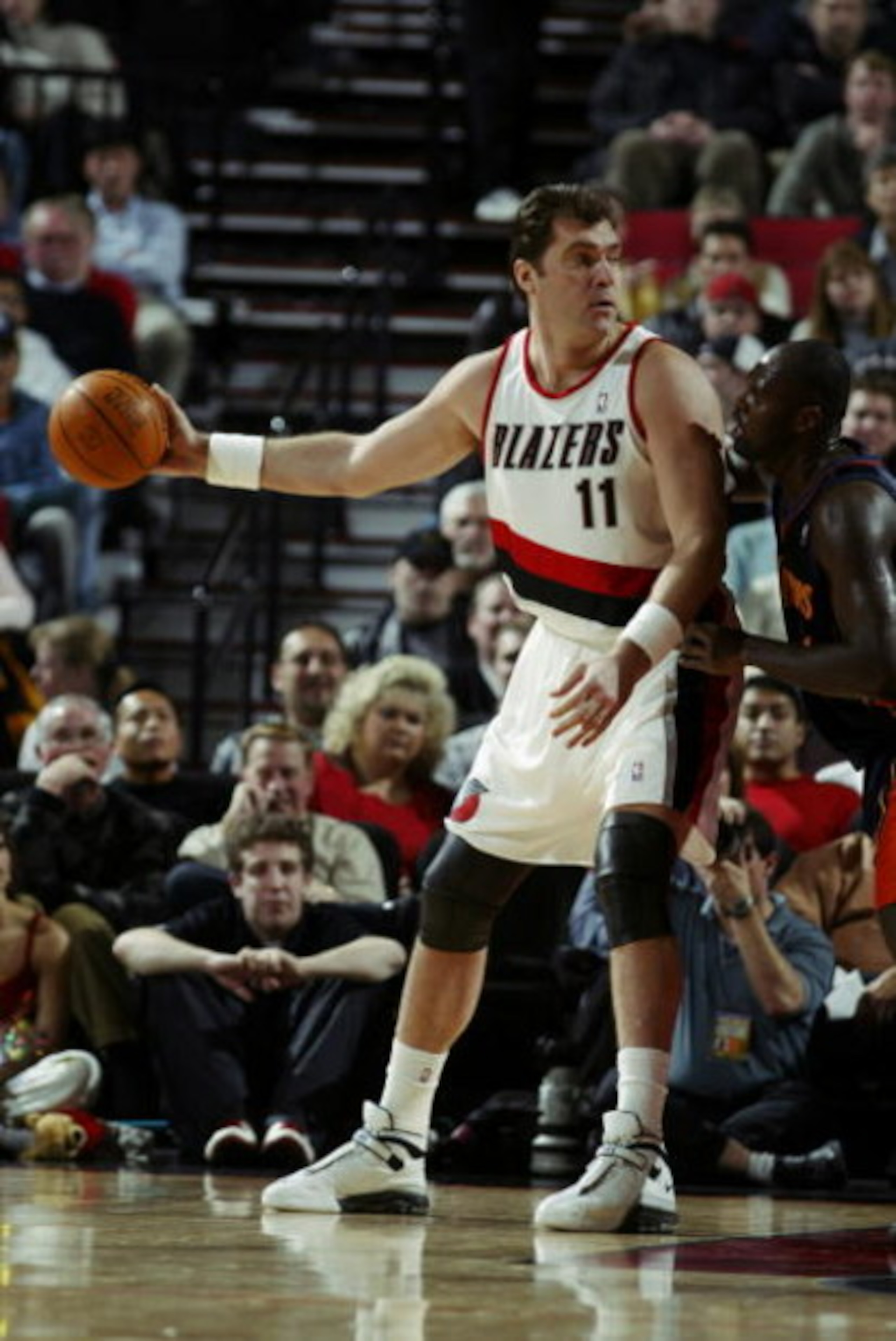 PORTLAND, OR - FEBRUARY 19:  Arvydas Sabonis #11 of the Portland Trail Blazers is defended by Adonal Foyle #31 of the Golden State Warriors during the NBA game at Rose Garden on February 19, 2003 in Portland, Oregon.  The Trail Blazers won 125-98.  NOTE T
