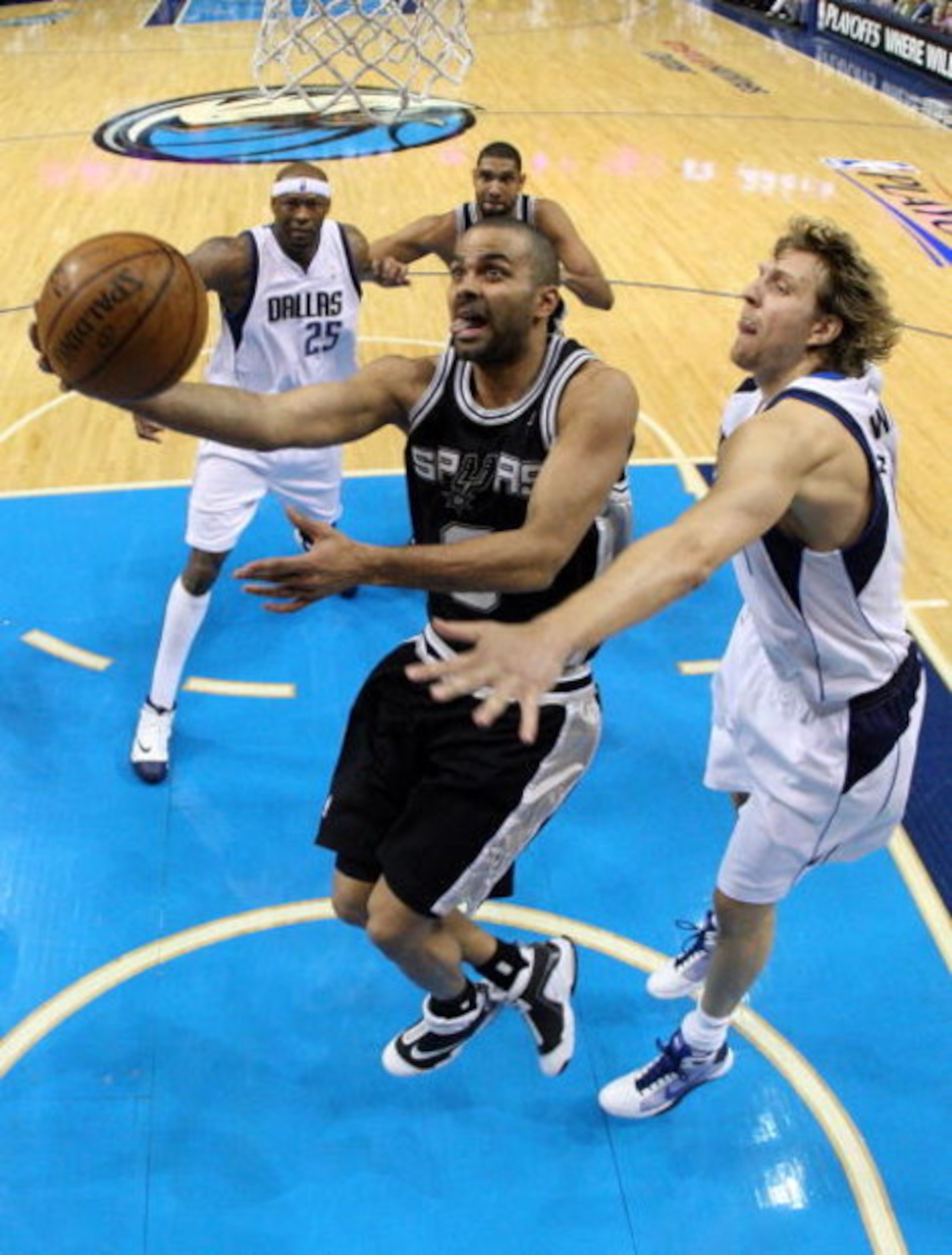 DALLAS - APRIL 25:  Guard Tony Parker #9 of the San Antonio Spurs takes a shot against Dirk Nowitzki #41 of the Dallas Mavericks in Game Four of the Western Conference Quarterfinals during the 2009 NBA Playoffs at American Airlines Center on April 25, 200