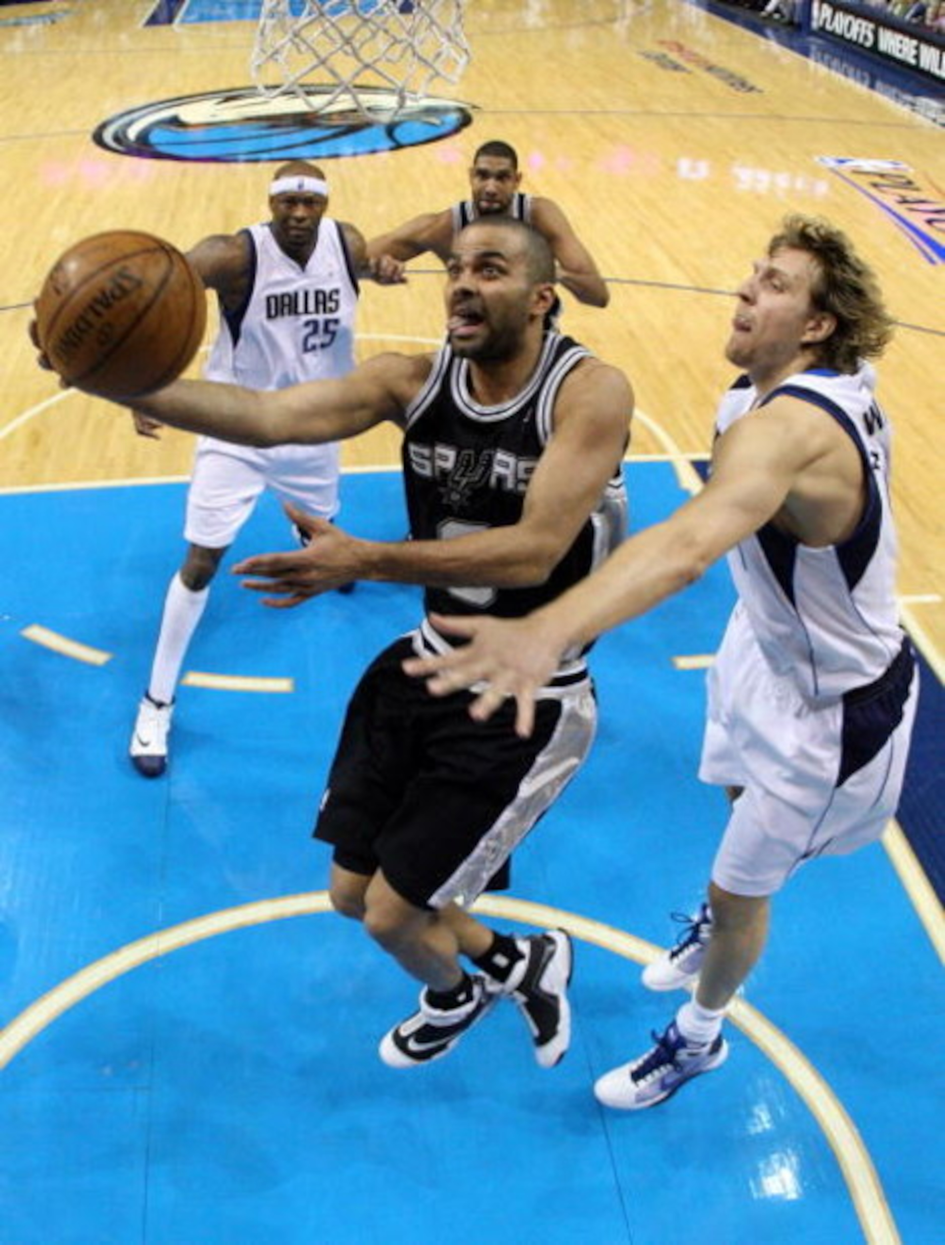 DALLAS - APRIL 25:  Guard Tony Parker #9 of the San Antonio Spurs takes a shot against Dirk Nowitzki #41 of the Dallas Mavericks in Game Four of the Western Conference Quarterfinals during the 2009 NBA Playoffs at American Airlines Center on April 25, 200
