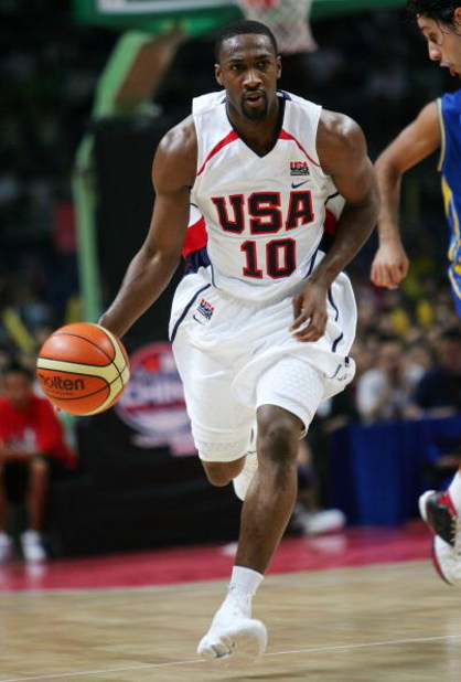 GUANGZHOU, CHINA - AUGUST 8:  Gilbert Arenas of the USA Senior Men's National Team controls the ball against Brazil Men's National Team during the China Basketball Challenge August 8, 2006 in Guangzhou, Guangdong province, China. USA won the game, 90-86. 
