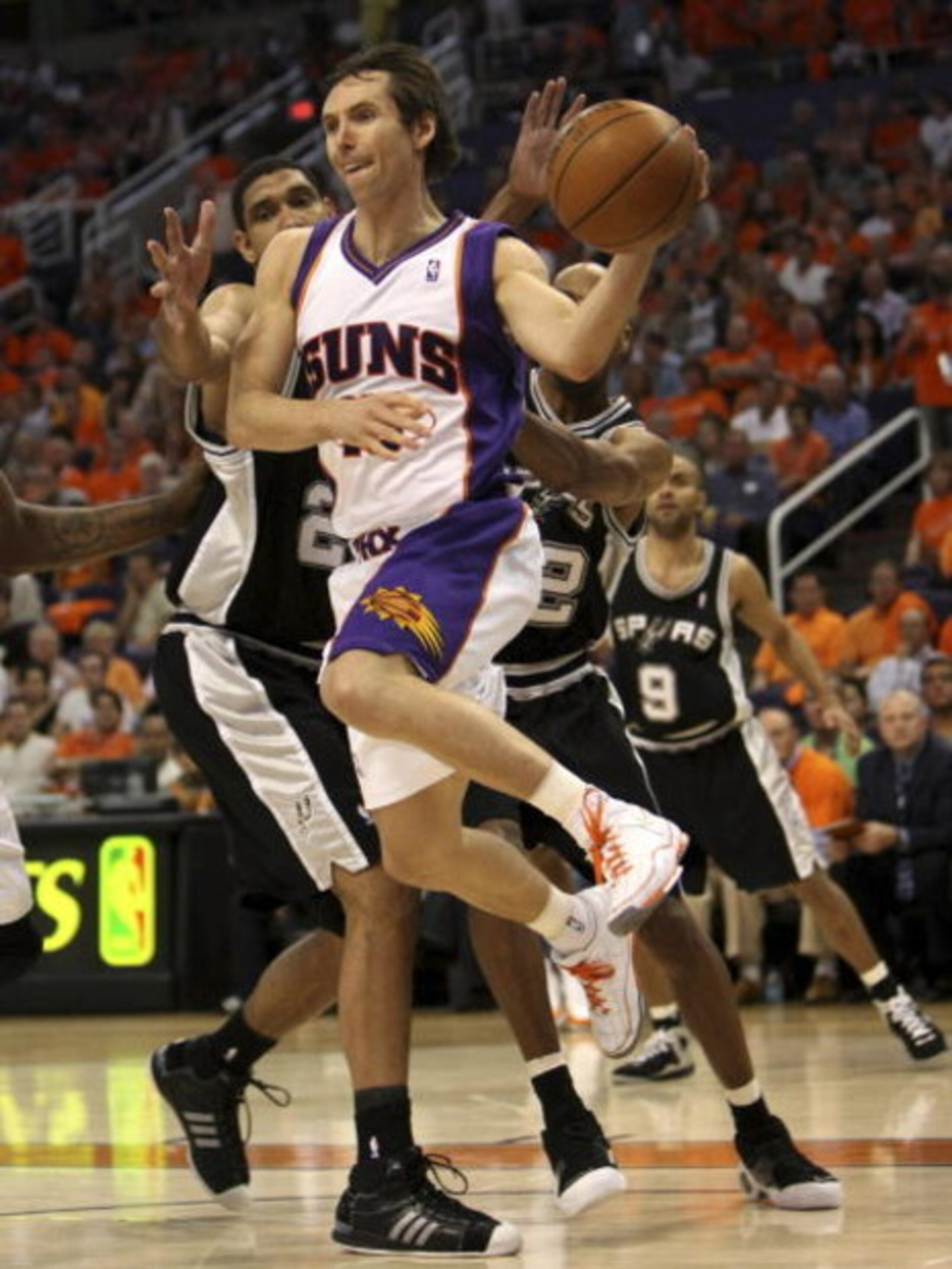 PHOENIX - APRIL 25:  Steve Nash #13 of the Phoenix Suns is defended by Tim Duncan #21 of the San Antonio Spurs during Game Three of the Western Conference Quarterfinals during the 2008 at NBA Playoffs at the at U.S. Airways Center on April 25, 2008.  (Pho