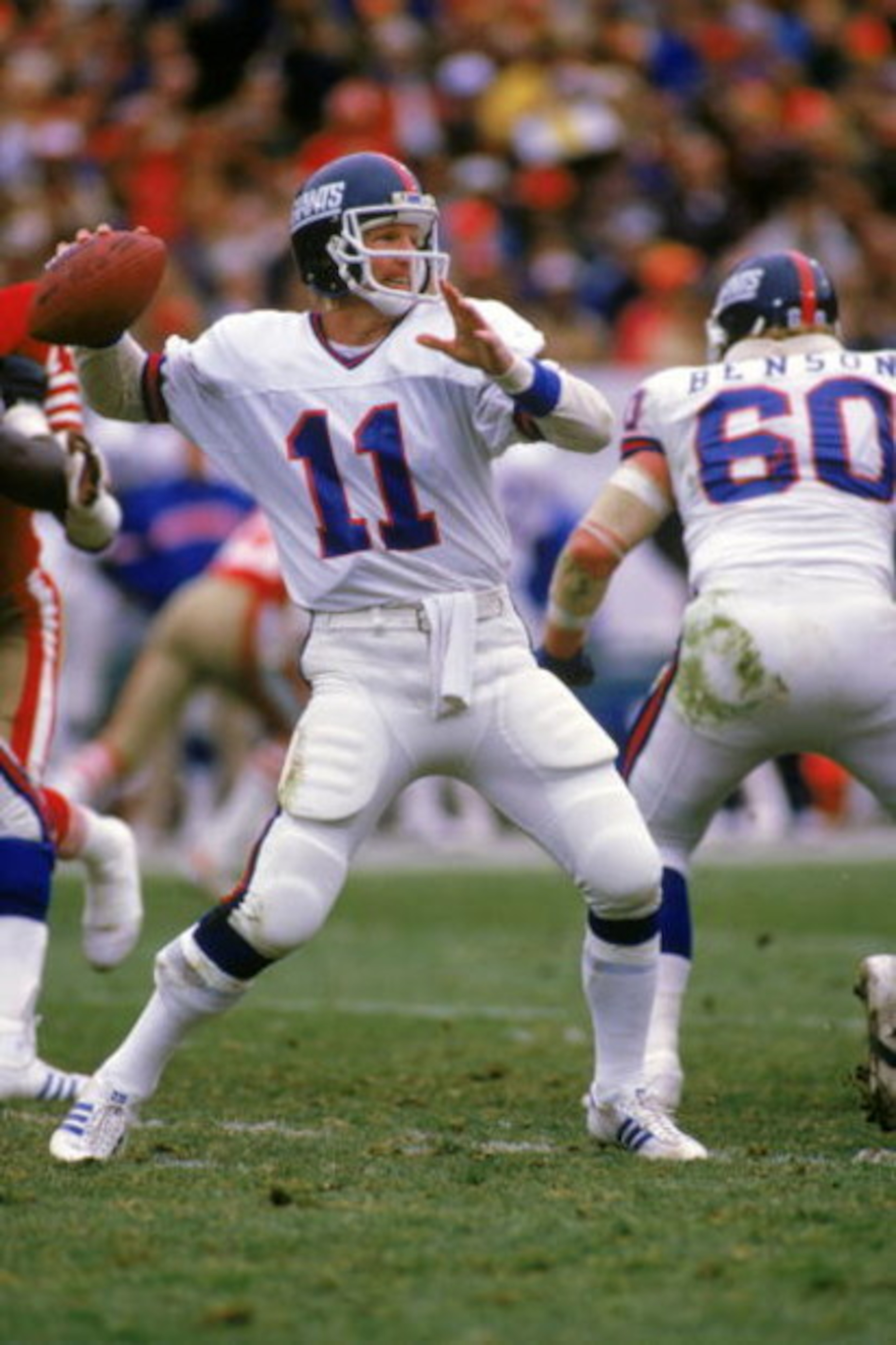 SAN FRANCISCO - DECEMBER 29: Quarterback Phil Simms #11 of the New York Giants passes against the San Francisco 49ers during the NFC Divisional Playoff game at Candlestick Park on December 29, 1984 in San Francisco, California. The 49ers won 21-10. (Ph SAN FRANCISCO - DECEMBER 29: Quarterback Phil Simms #11 of the New York Giants passes against the San Francisco 49ers during the NFC Divisional Playoff game at Candlestick Park on December 29, 1984 in San Francisco, California. The 49ers won 21-10. (Ph