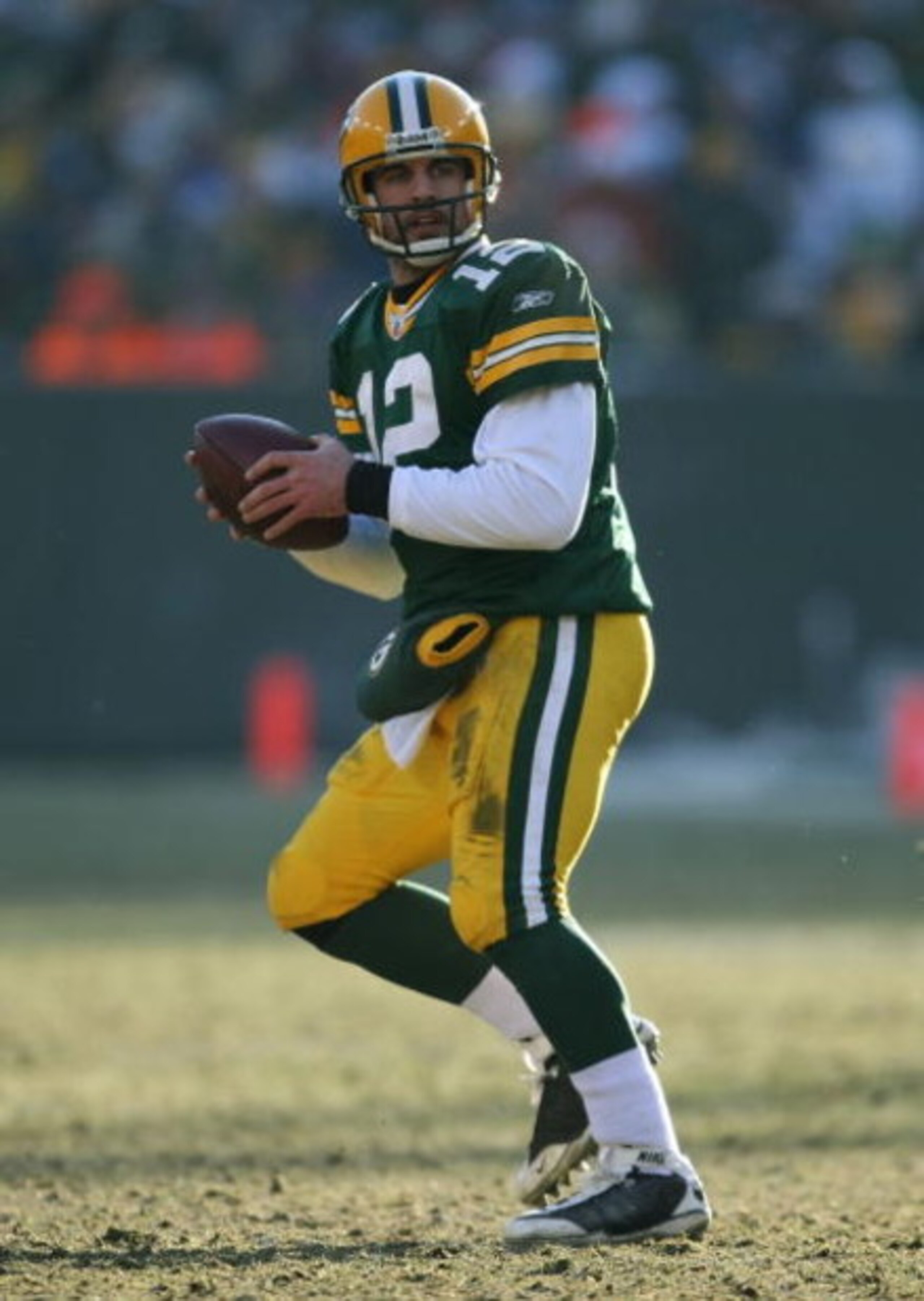 GREEN BAY, WI - DECEMBER 28: Aaron Rodgers #12 of the Green Bay Packers looks for a receiver against the Detroit Lions on December 28, 2008 at Lambeau Field in Green Bay, Wisconsin. The Packers defeated the Lions 31-21. (Photo by Jonathan Daniel/Getty Ima
