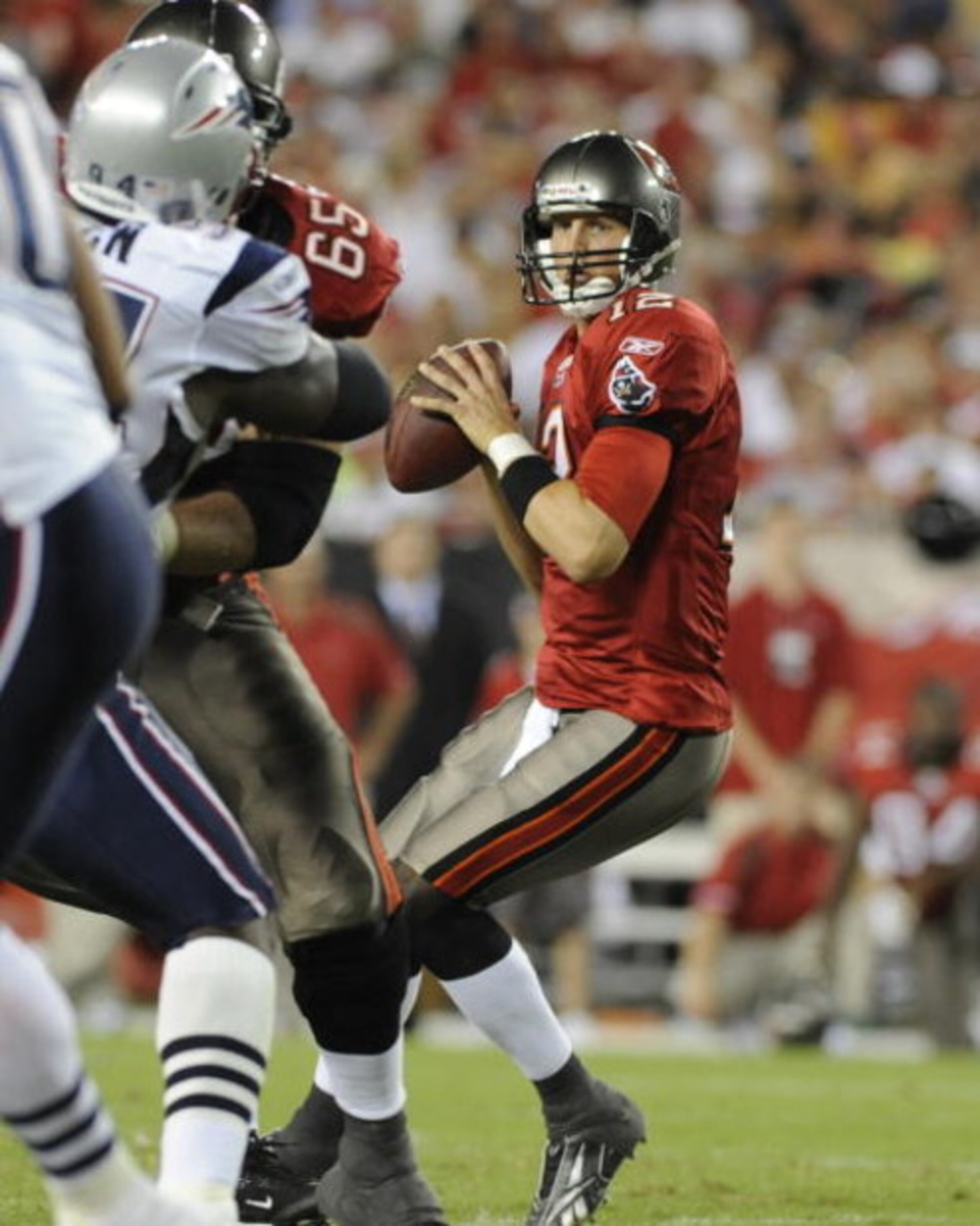 TAMPA, FL - AUGUST 17: Quarterback Luke McCown #12 of the Tampa Bay Buccaneers sets to pass against the New England Patriots at Raymond James Stadium on August 17, 2008 in Tampa, Florida.   (Photo by Al Messerschmidt/Getty Images) 