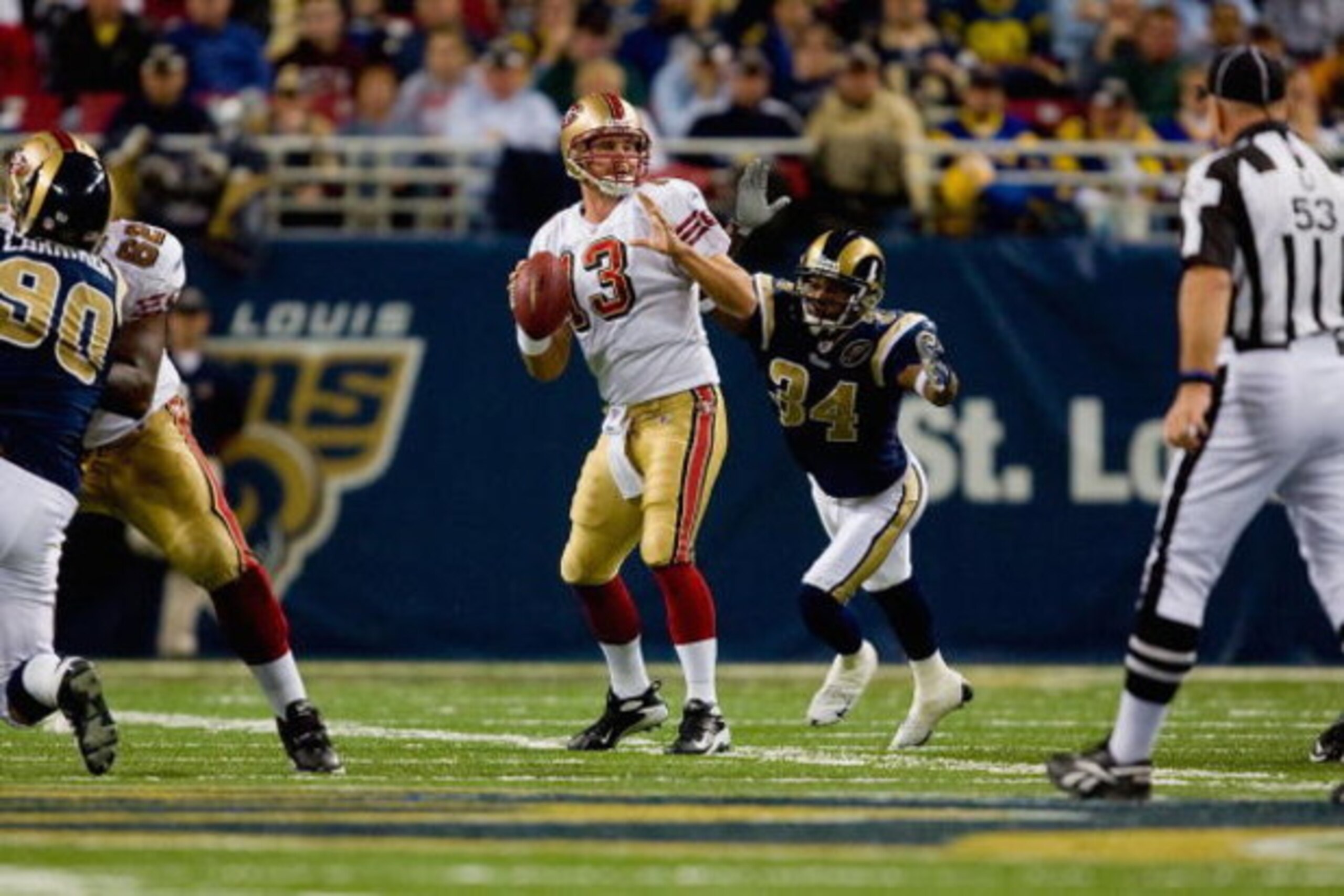 ST. LOUIS, MO - DECEMBER 21:  Fakhir Brown #34 of the St. Louis Rams bears down upon an unsuspecting Shaun Hill #13 of the San Francisco 49ers during the game at the Edward Jones Dome on December 21, 2008 in St. Louis, Missouri. The 49ers won 17-16. (Phot