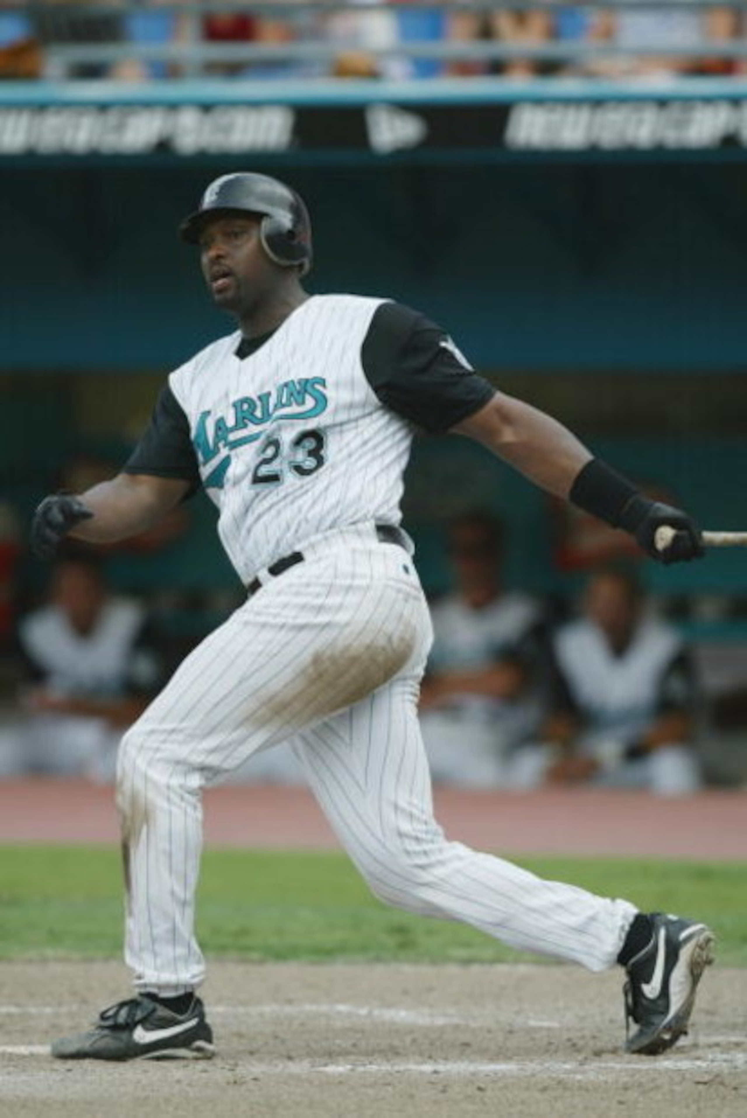 MIAMI - JULY 21:  Catcher Charles Johnson #23 of the Florida Marlins swings the bat during the MLB game against the Montreal Expos on July 21, 2002 at Pro Player Stadium in Miami, Florida.  The Expos won 4-0.  (Photo By Eliot J. Schechter/Getty Images)