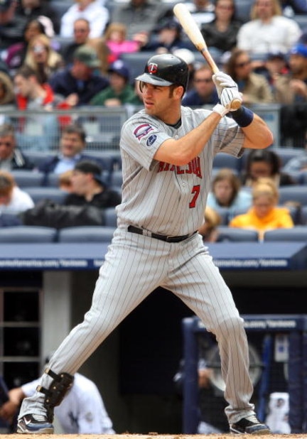 NEW YORK - MAY 17:  Joe Mauer #7 of the Minnesota Twins bats against the New York Yankees on May 17, 2009 at Yankee Stadium in the Bronx borough of New York City. The Yankees defeated the Twins 3-2 in ten innings.  (Photo by Jim McIsaac/Getty Images)
