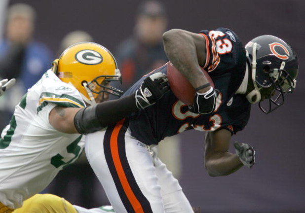 CHICAGO - JANUARY 2: Linebacker Nick Barnett #56 of the Green Bay Packers brings down wide receiver David Terrell #83 of the Chicago Bears on January 2, 2005 at Soldier Field in Chicago, Illinois. (Photo by Jonathan Daniel/Getty Images)