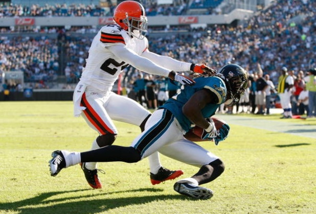 JACKSONVILLE, FL - OCTOBER 26:  Reggie Williams #11 of the Jacksonville Jaguars makes a touchdown catch against Eric Wright #24 of the Cleveland Browns in a game at Jacksonville Muncipal Stadium on October 26, 2008 in Jacksonville, Florida.  (Photo by Sam