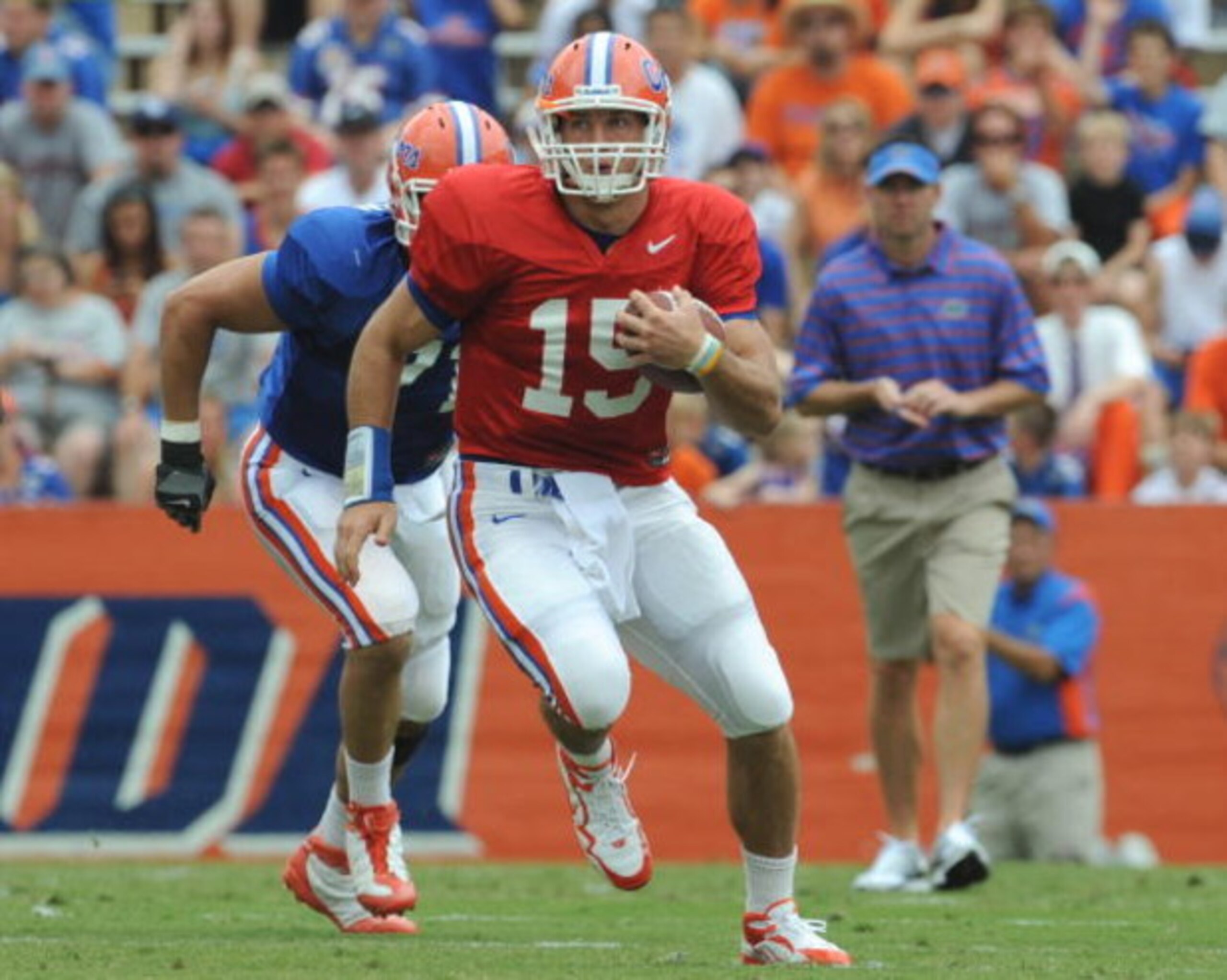 GAINESVILLE, FL - APRIL 18: Quarterback Tim Tebow #15 of the University of Florida rushes upfield during the spring football Orange and Blue game April 18, 2009 at Ben Hill Griffin Stadium in Gainesville, Florida.  (Photo by Al Messerschmidt/Getty Images)