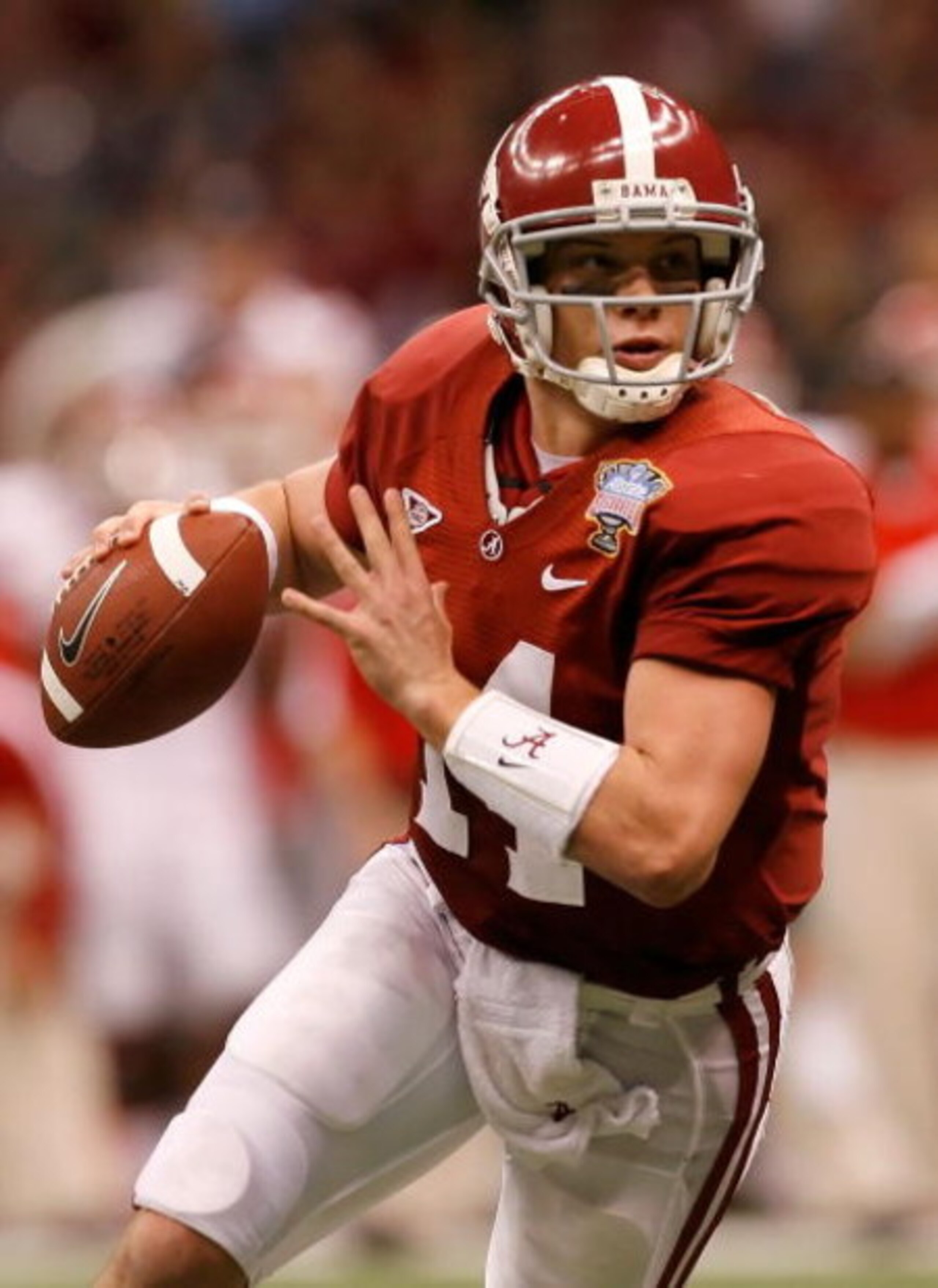 NEW ORLEANS - JANUARY 02:  Quarterback John Parker Wilson #14 of the Alabama Crimson Tide rolls out of the pocket in the second quarter while taking on the Utah Utes during the 75th Allstate Sugar Bowl at the Louisiana Superdome on January 2, 2009 in New 